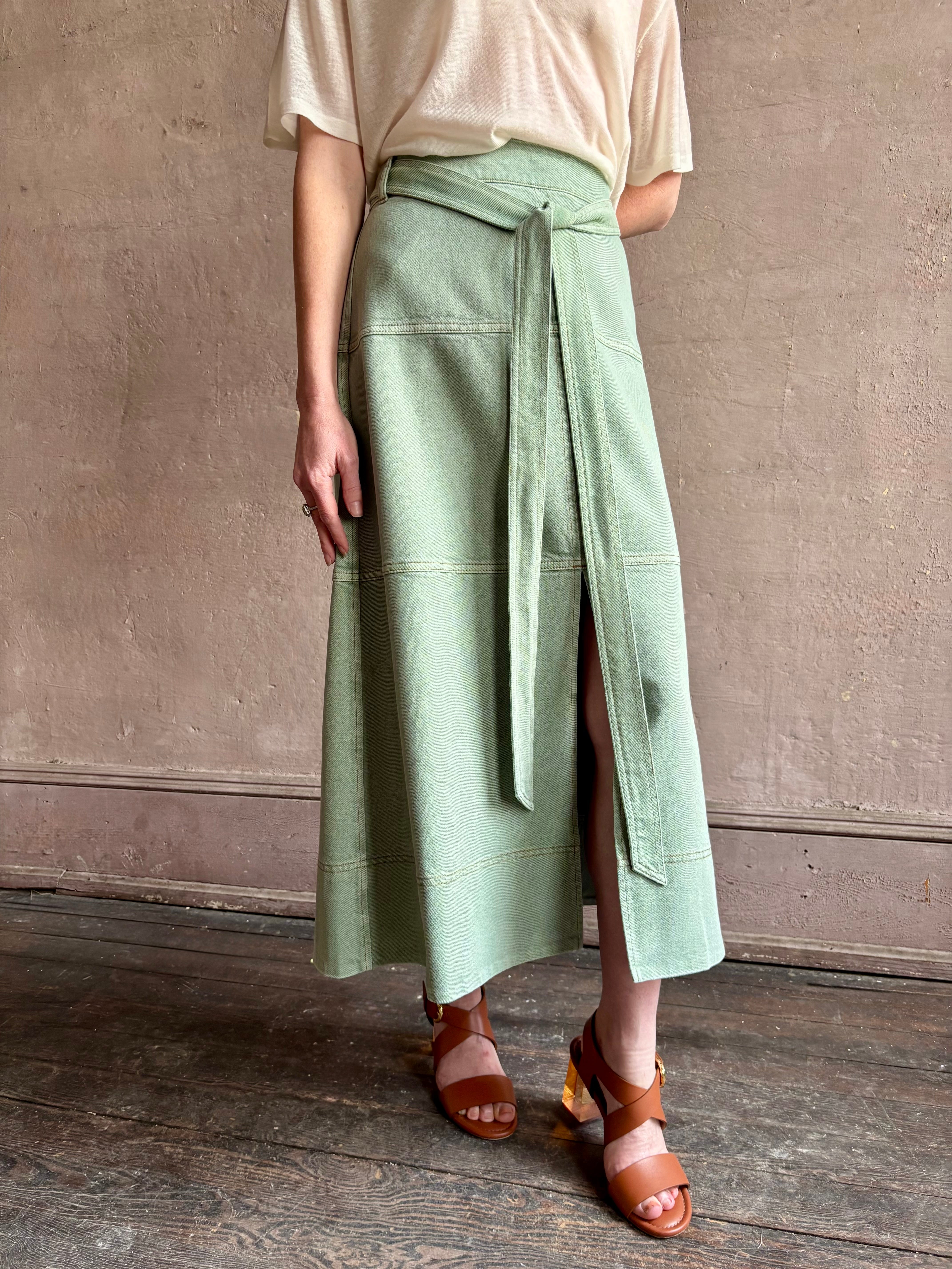 Mature woman wearing premium designer Tanya Taylor Hudley timeless cotton maxi A-line Skirt in Pistachio green