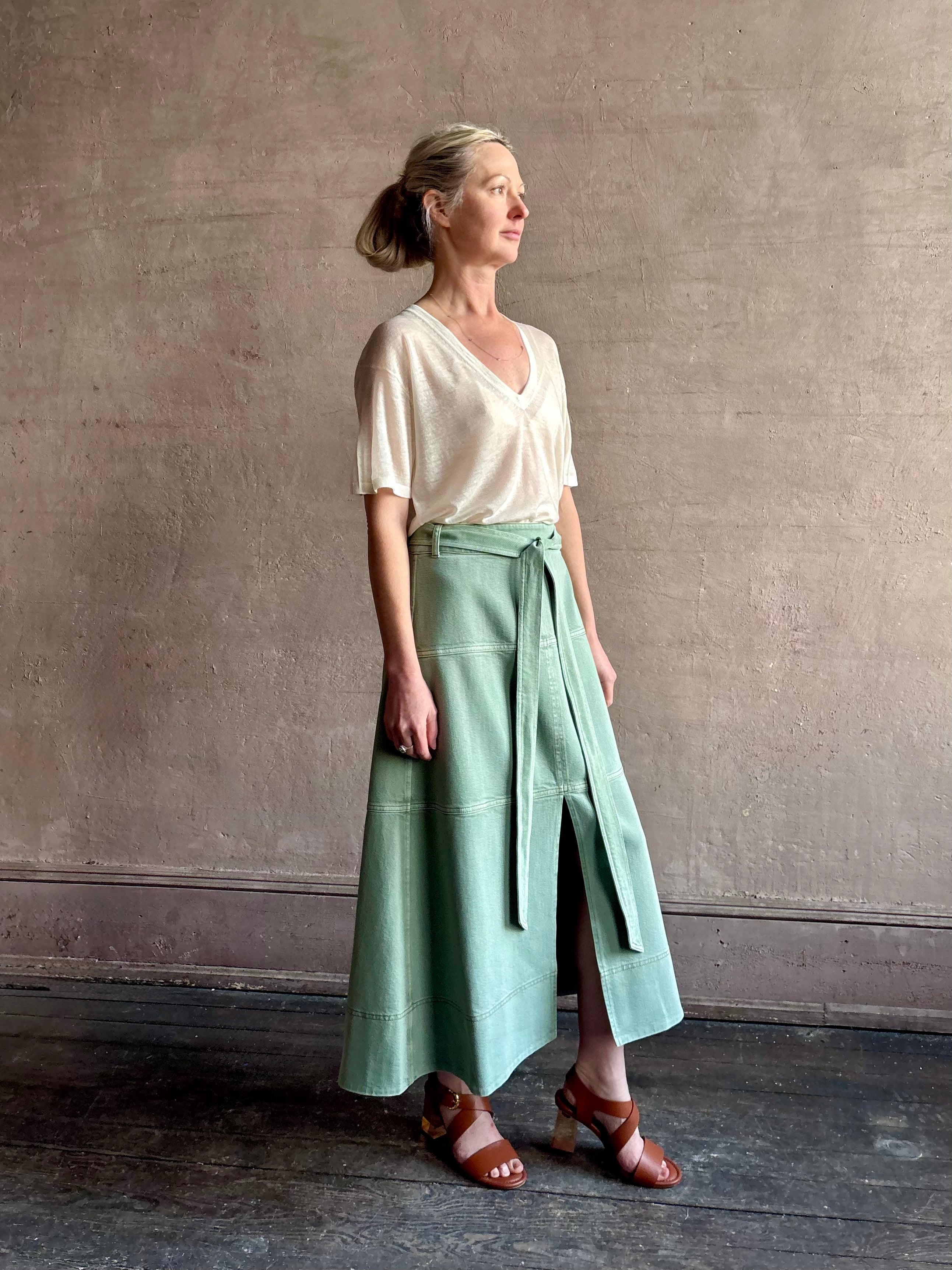 Mature woman wearing premium designer Tanya Taylor Hudley lightweight cotton maxi A-line Skirt in Pistachio green