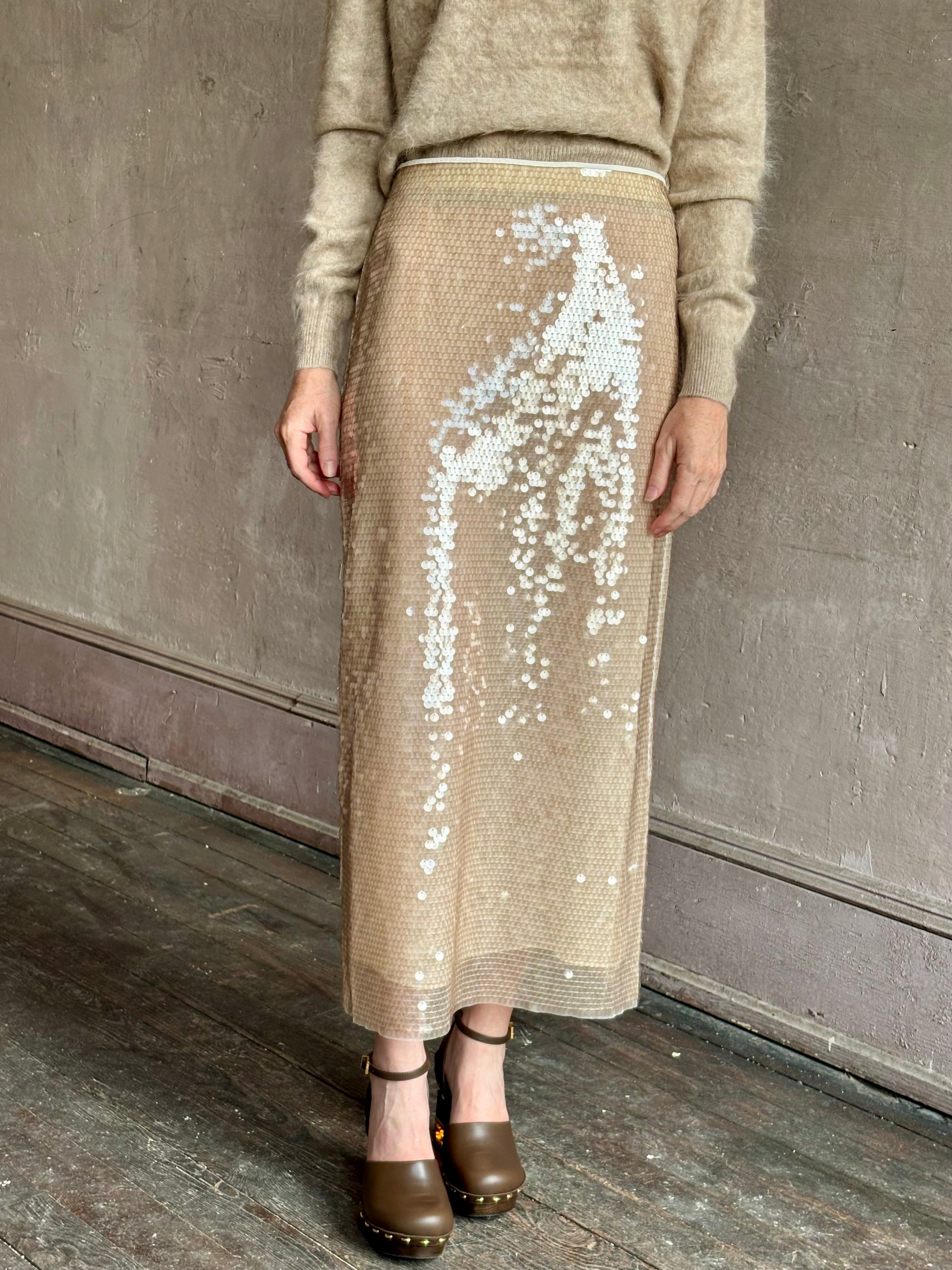 Image of mature woman wearing designer Tanya Taylor Kiah sequin maxi-length pencil skirt with flattering fit and in a neutral beige colorway