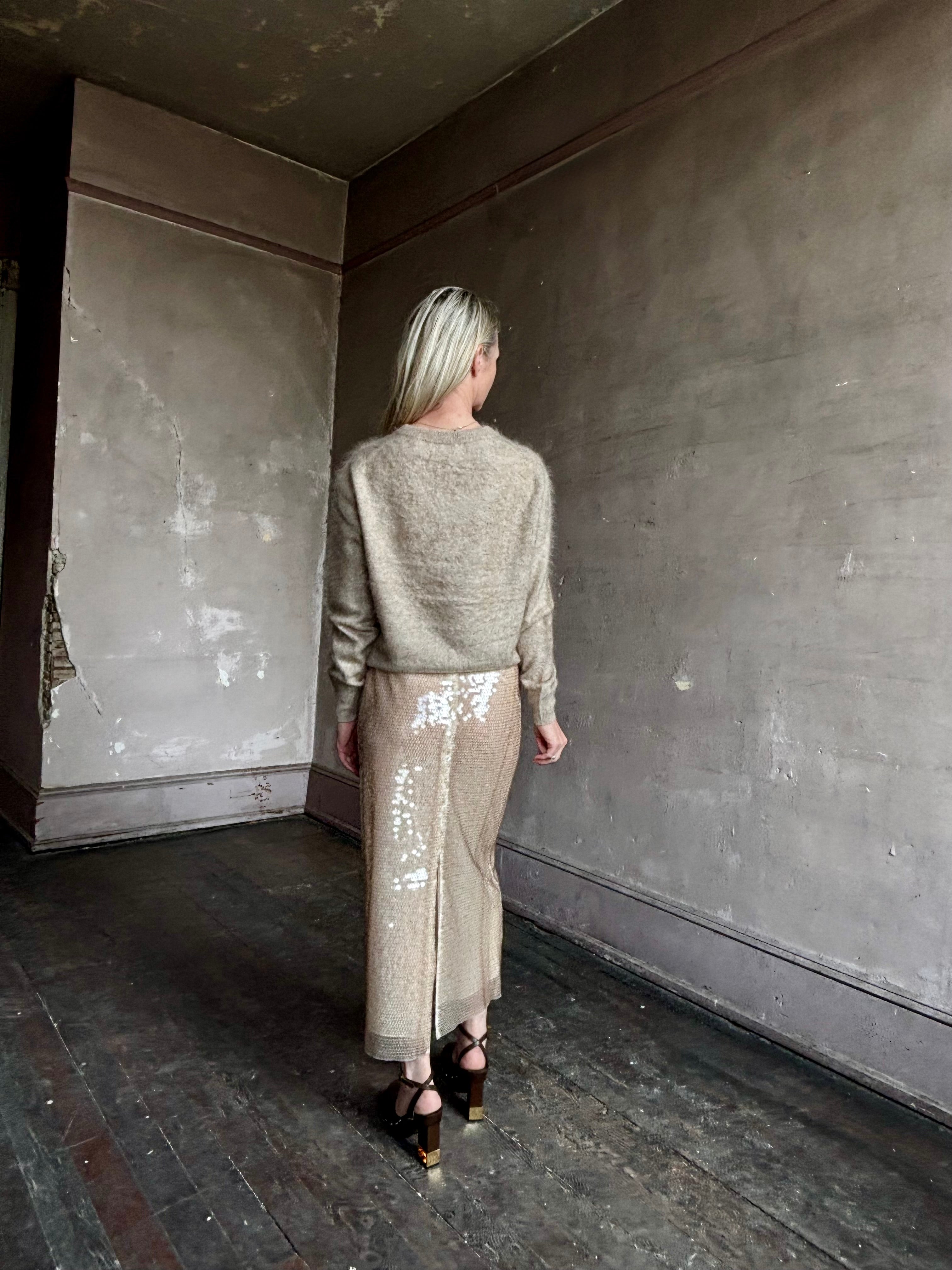Image of mature woman wearing designer Tanya Taylor Kiah sequin maxi-length pencil skirt with flattering fit and in a neutral beige colorway