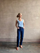 Image of woman wearing luxury cashmere knitwear Tanya Taylor Rory Cashmere Tank top in Pale Blue with a feminine scoop neckline 