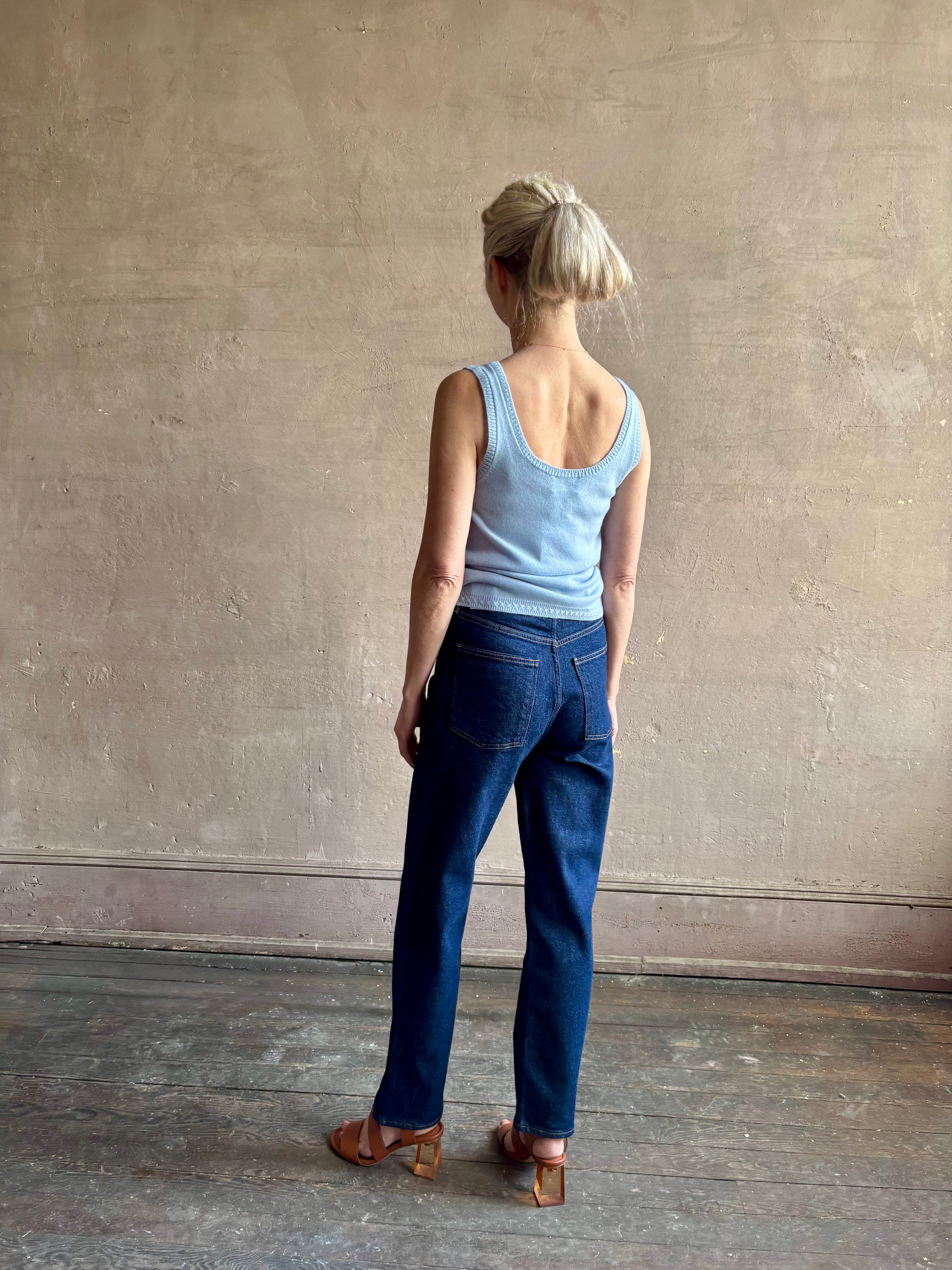 Image of woman wearing luxury cashmere knitwear Tanya Taylor Rory Cashmere Tank top in Pale Blue with a feminine scoop back