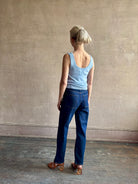 Image of woman wearing luxury cashmere knitwear Tanya Taylor Rory Cashmere Tank top in Pale Blue with a feminine scoop back