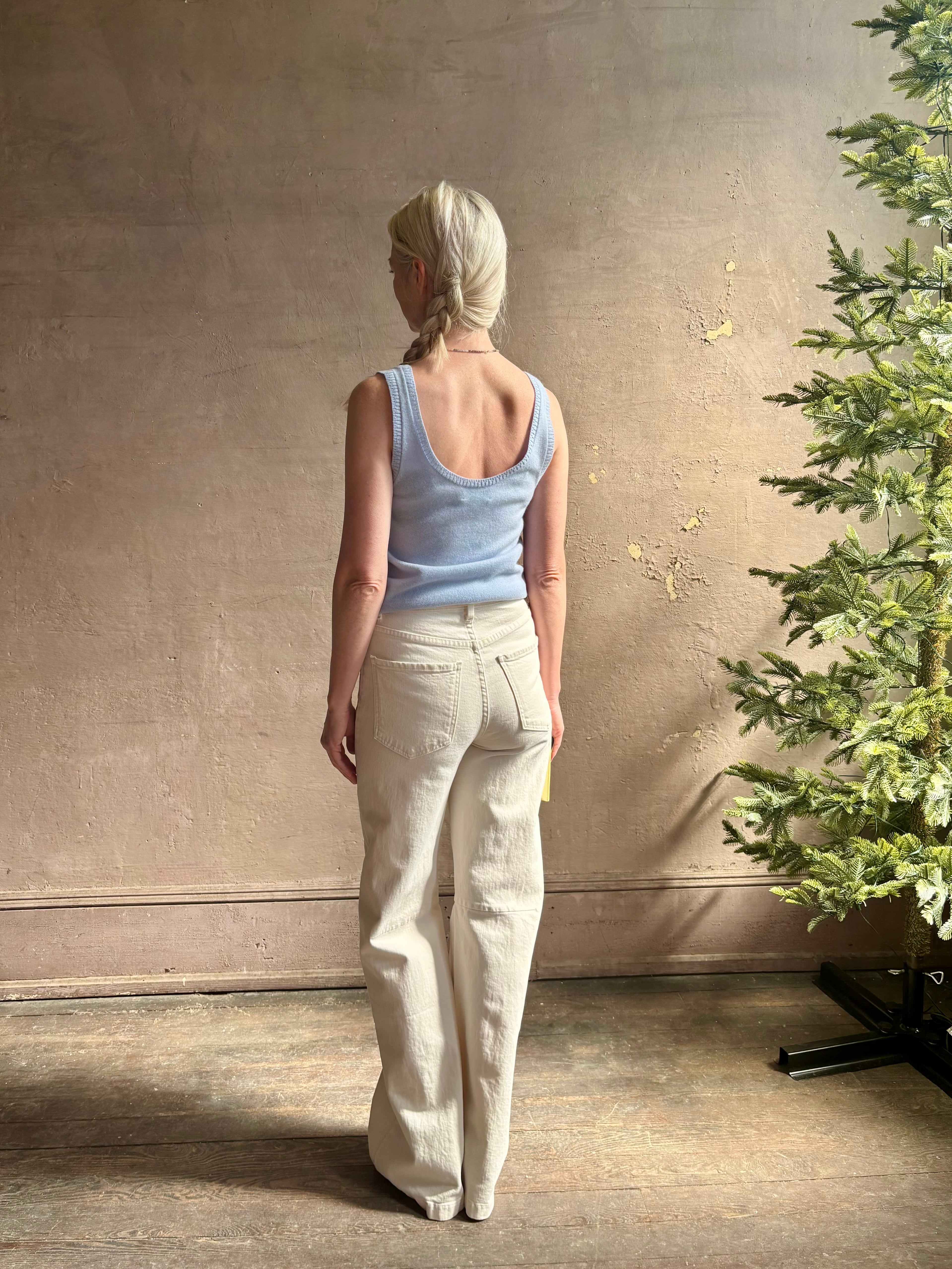 Image of woman wearing luxury cashmere knitwear Tanya Taylor Rory Cashmere Tank top in Pale Blue with a feminine scoop neckline