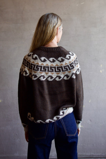 Image featuring a woman wearing the Great Greek Key brown pullover sweater with a khaki and cream pattern in the softest texture.