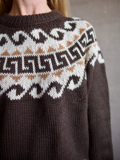 Image featuring a woman wearing the Great Greek Key brown pullover sweater with a khaki and cream pattern in the softest texture.