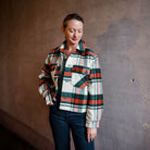 Image featuring a woman wearing The Great Smith fully lined jacket from The Great with a boxy fit through the body, a slightly cropped length and subtle swing at the back.