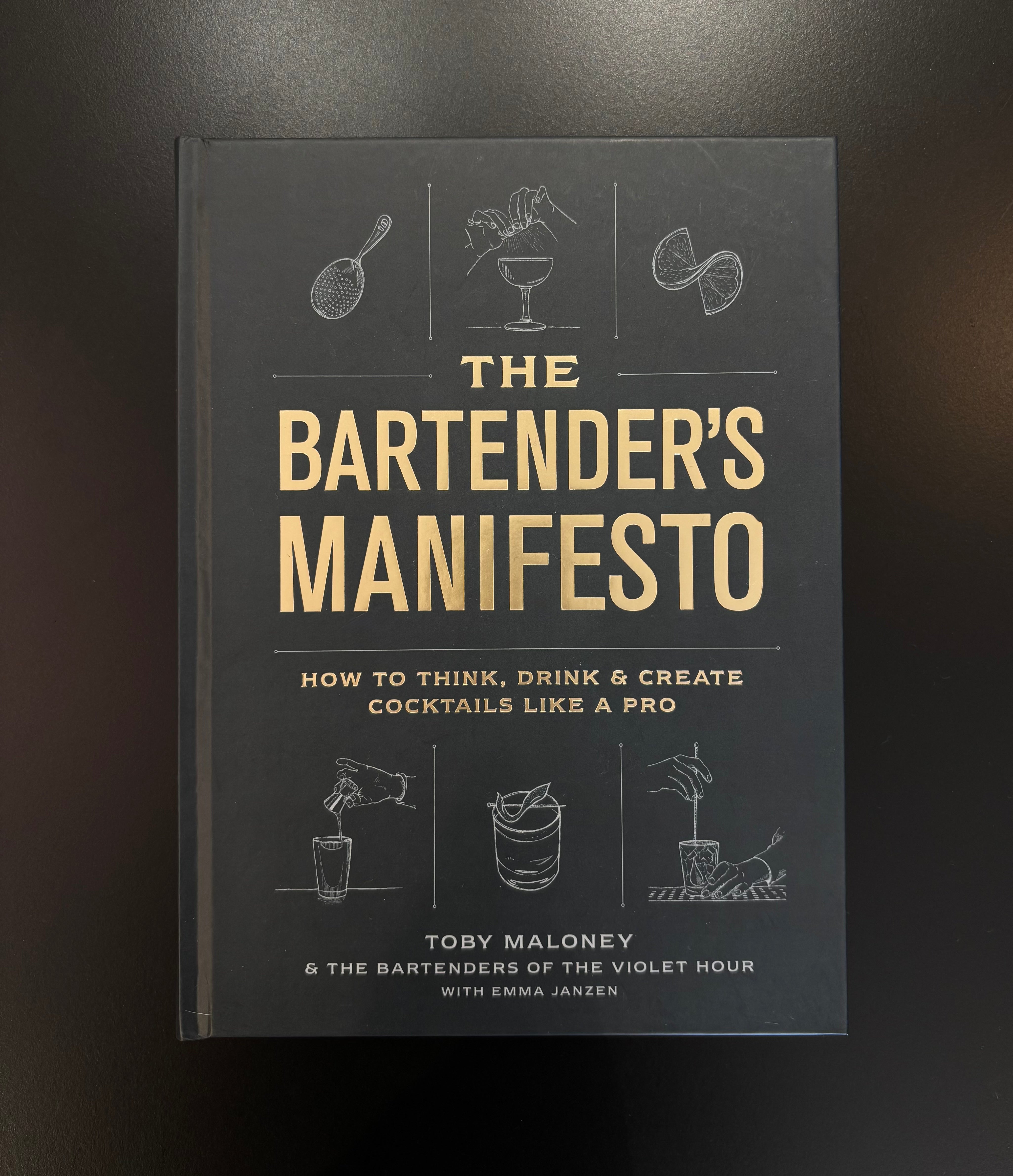 The Bartender's Manifesto book by Toby Maloney hardcover on the principles of balance flavor and technique behind great cocktails