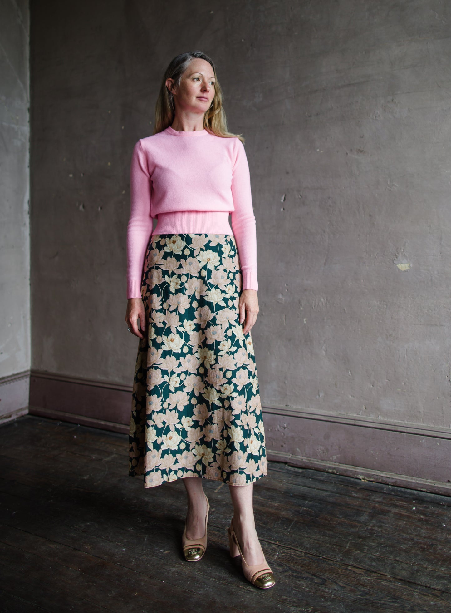 Image featuring a woman wearing the Demi Floral skirt by Trovata with a high rise and a-line fit in a beautiful floral pattern.