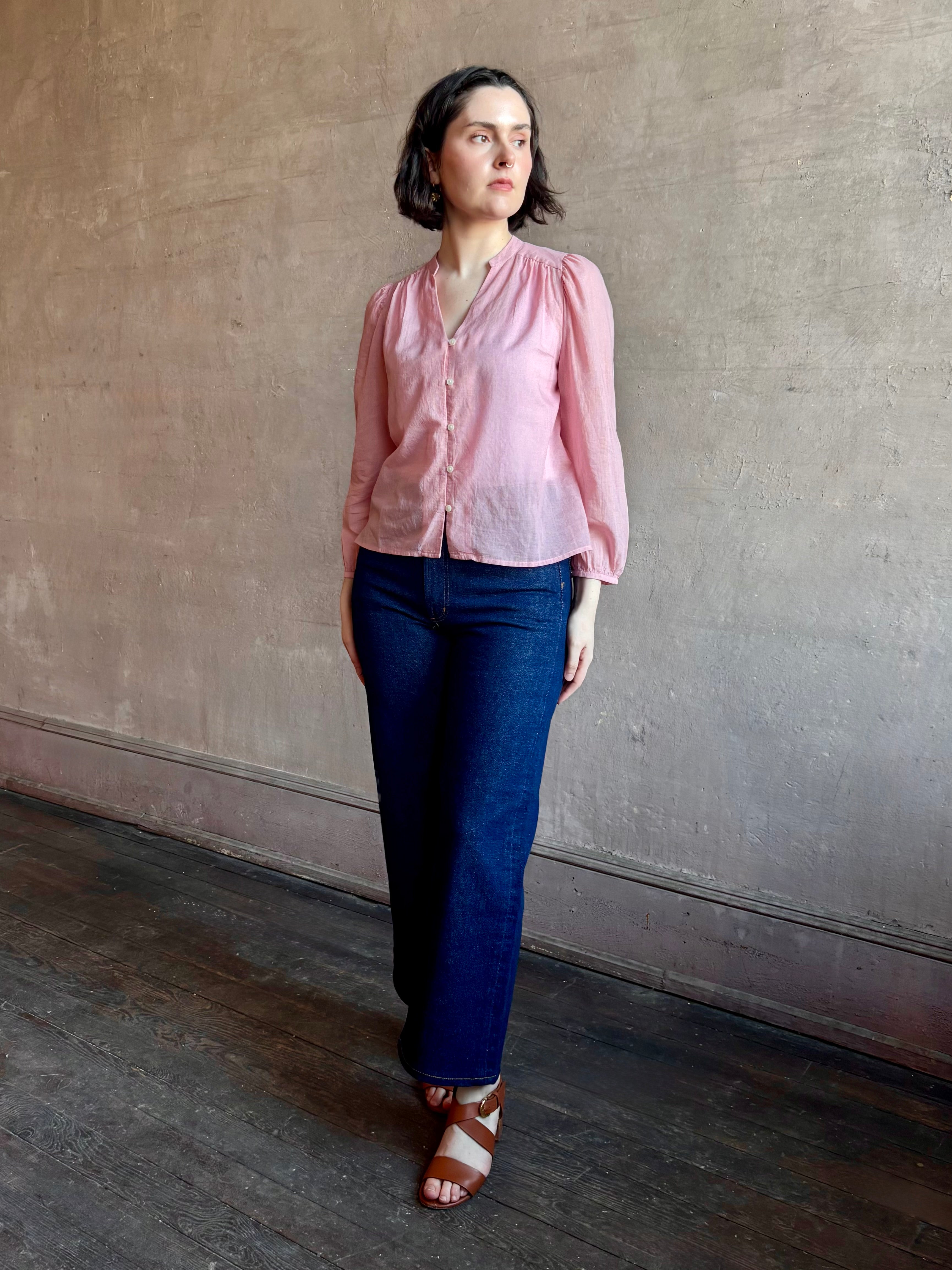 woman wearing premium lightweight cotton poplin Maisey Blouse by Trovata with long sleeves and v-neck in pink and white tiny Houndstooth print