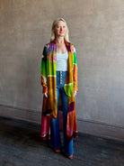 Woman wearing the Critique Long Sleeve fluid Silk maxi Dress from Ulla Johnson in  wearable art abstract print via a collaboration with American painter Helen Frankenthaler