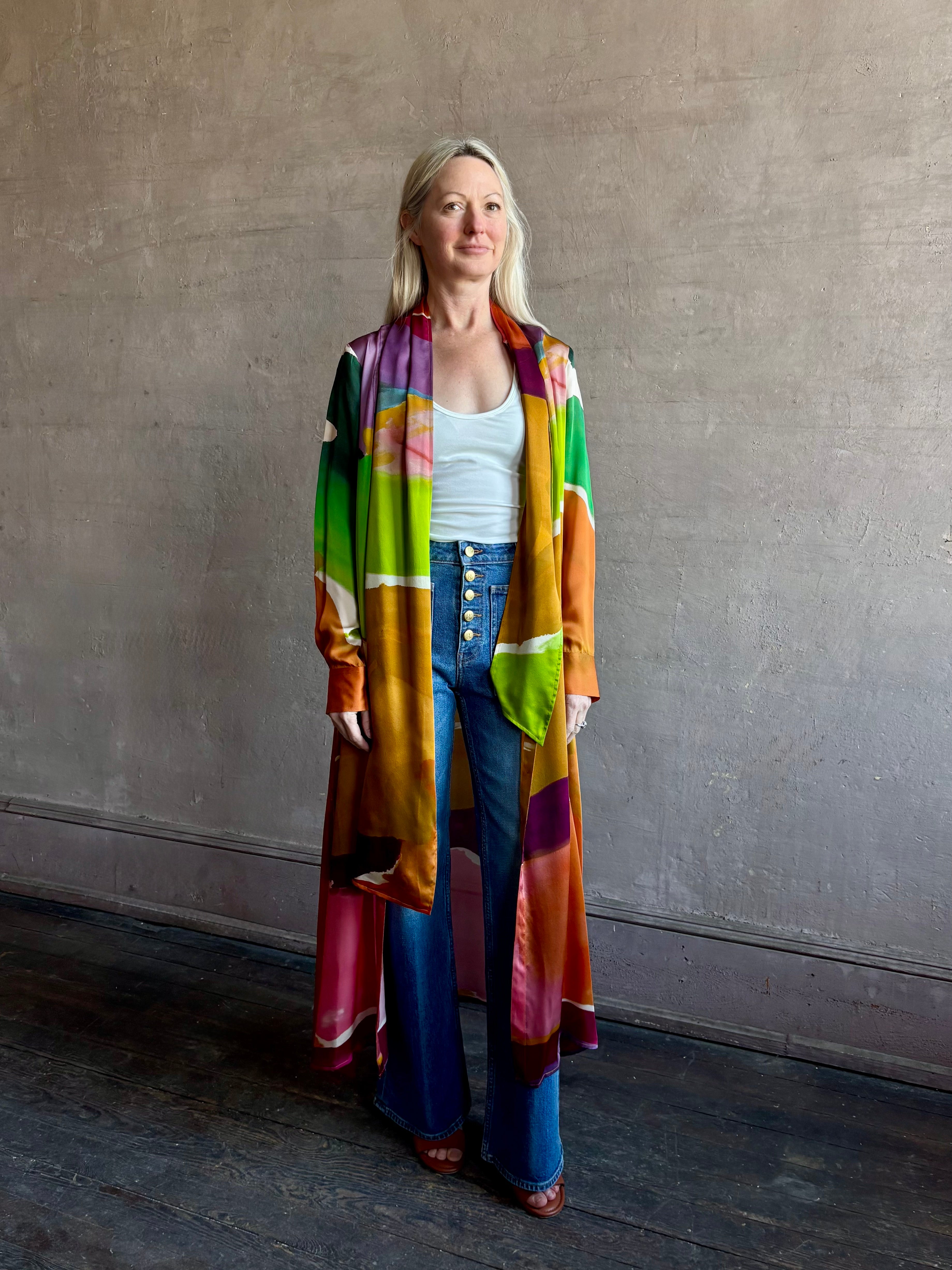 Woman wearing the Critique Long Sleeve fluid Silk maxi Dress from Ulla Johnson in  wearable art abstract print via a collaboration with American painter Helen Frankenthaler