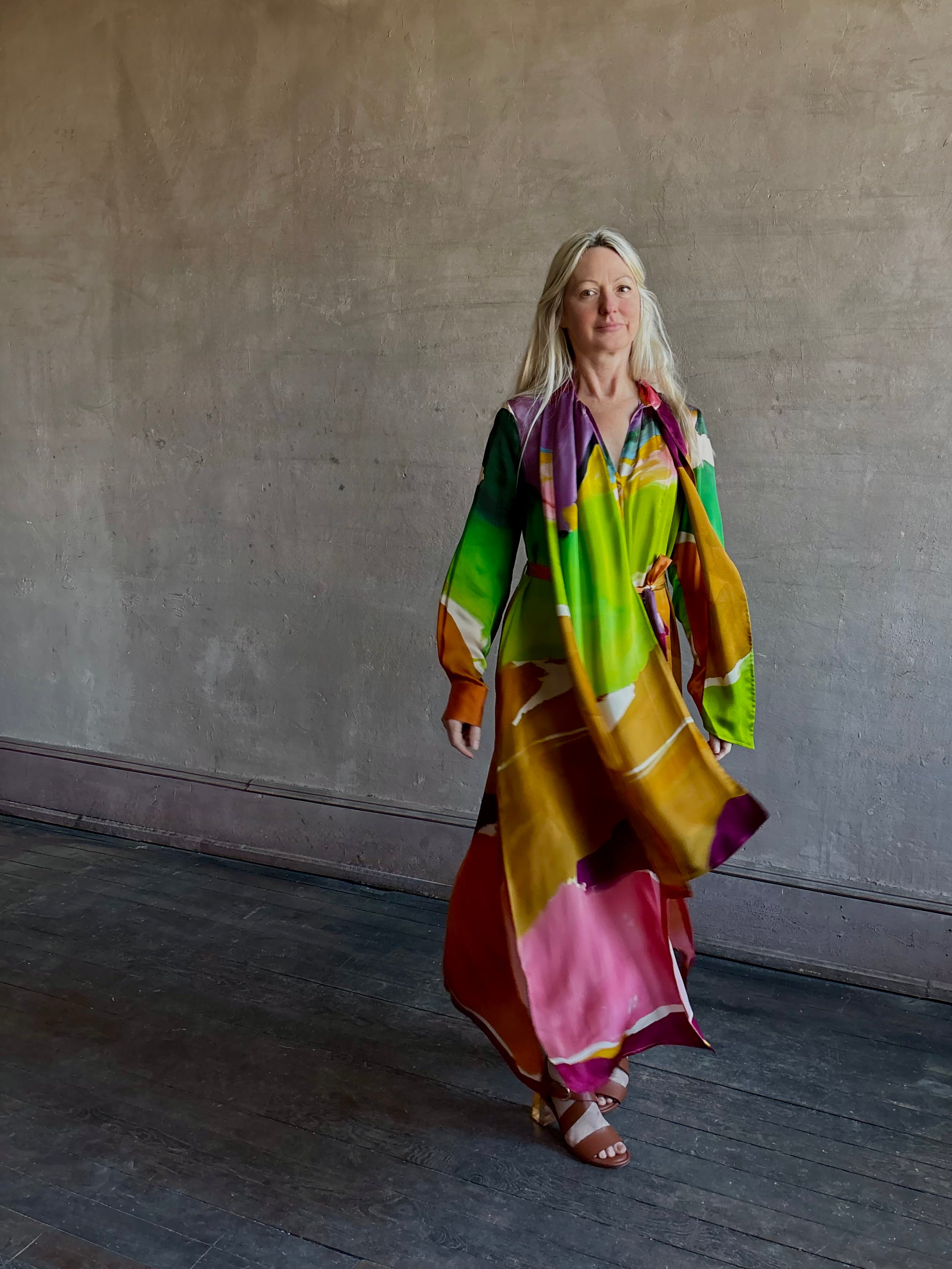 Woman wearing the Critique Long Sleeve fluid Silk maxi Dress from Ulla Johnson in  wearable art abstract print via a collaboration with American painter Helen Frankenthaler