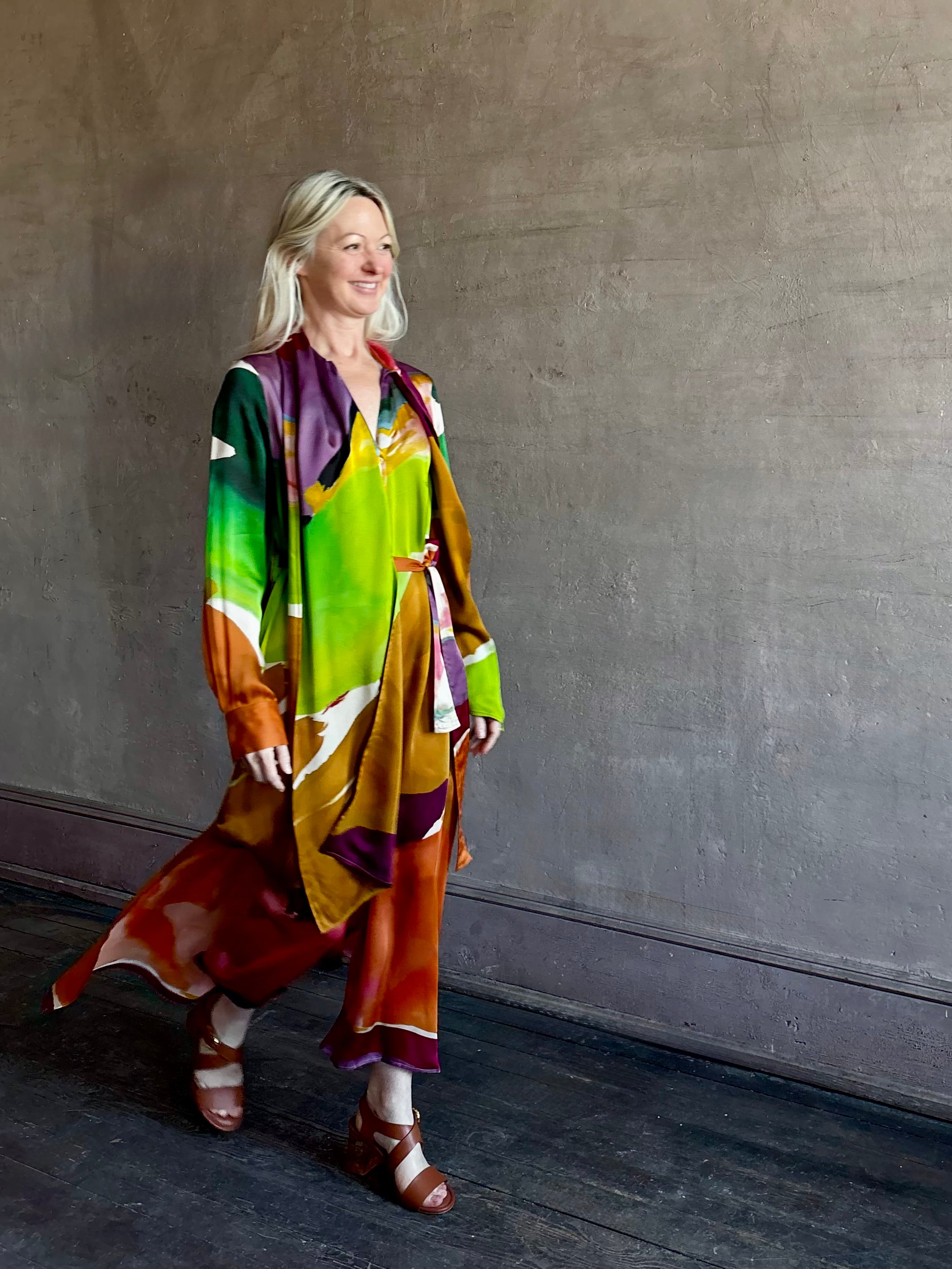 Woman wearing the Critique Long Sleeve fluid Silk maxi Dress from Ulla Johnson in  wearable art abstract print via a collaboration with American painter Helen Frankenthaler