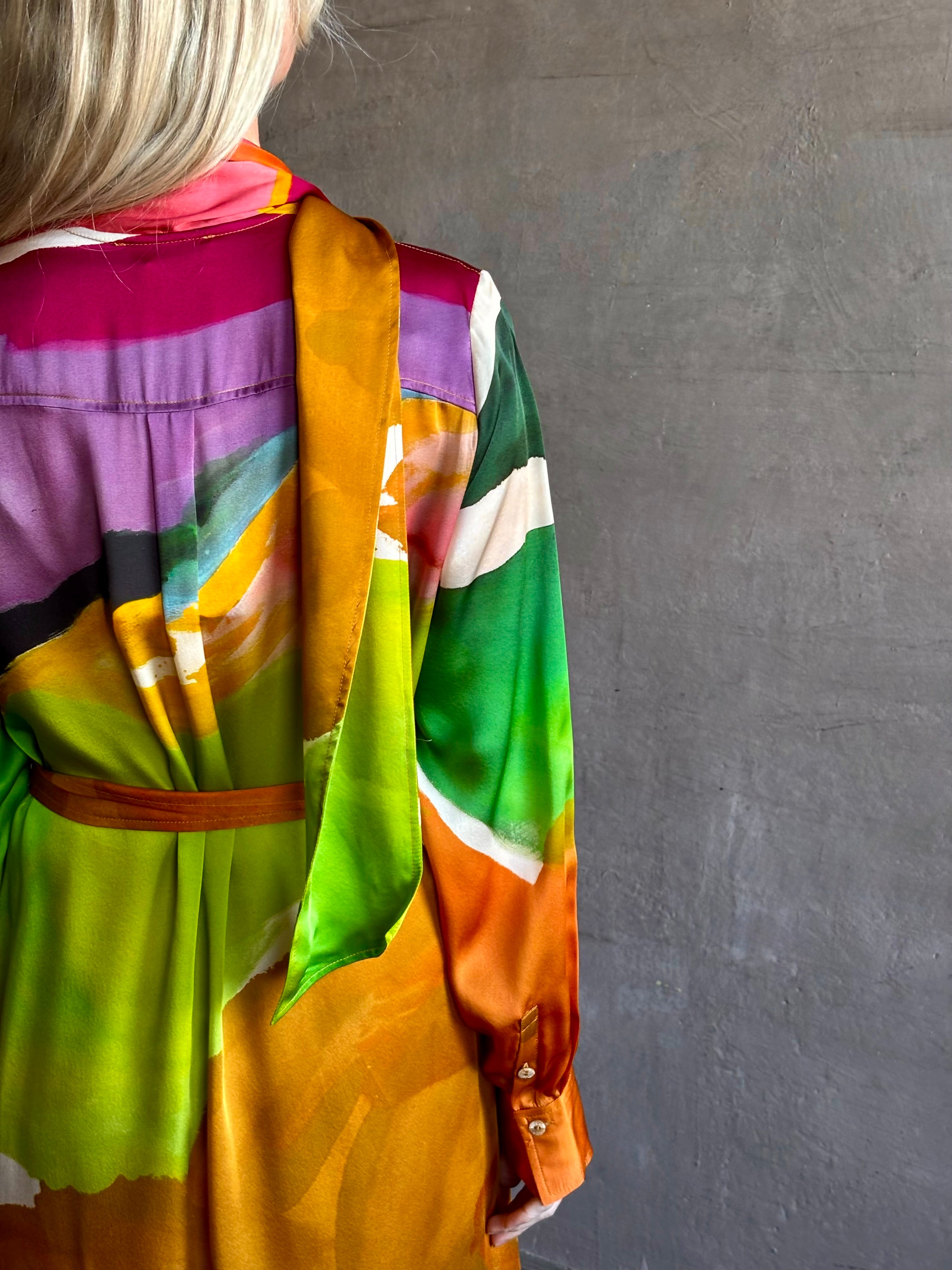Woman wearing the Critique Long Sleeve fluid Silk maxi Dress from Ulla Johnson in  wearable art abstract print via a collaboration with American painter Helen Frankenthaler