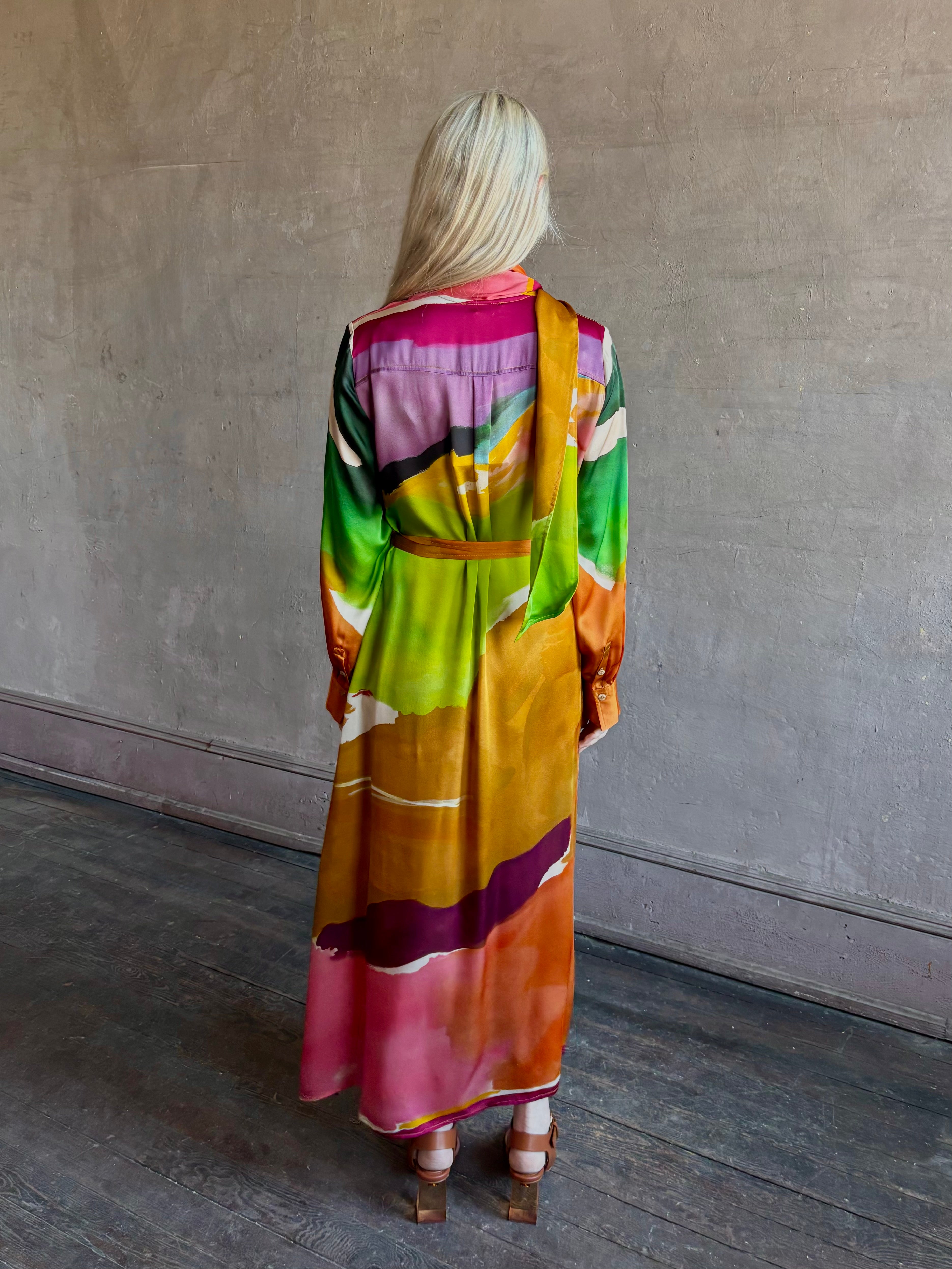 Woman wearing the Critique Long Sleeve fluid Silk maxi Dress from Ulla Johnson in  wearable art abstract print via a collaboration with American painter Helen Frankenthaler