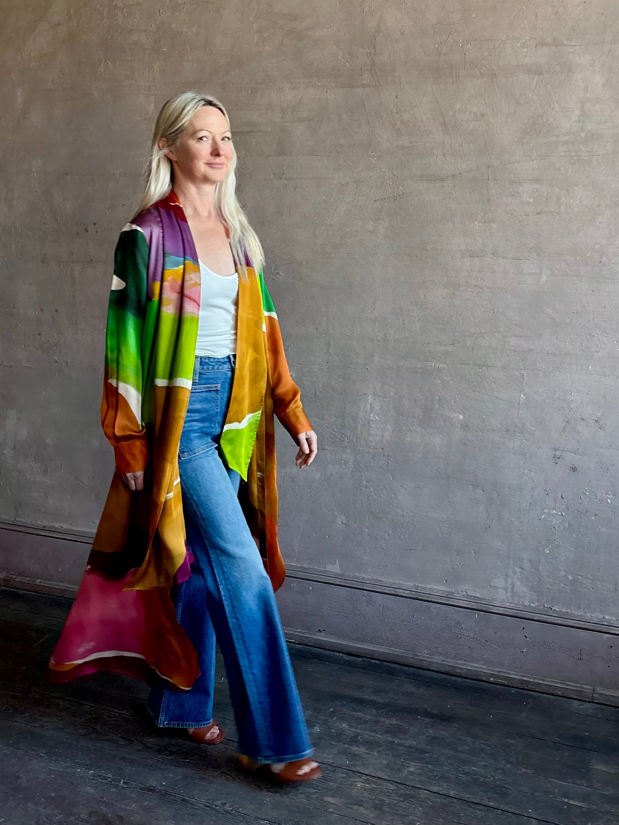 Woman wearing the Critique Long Sleeve fluid Silk maxi Dress from Ulla Johnson in  wearable art abstract print via a collaboration with American painter Helen Frankenthaler