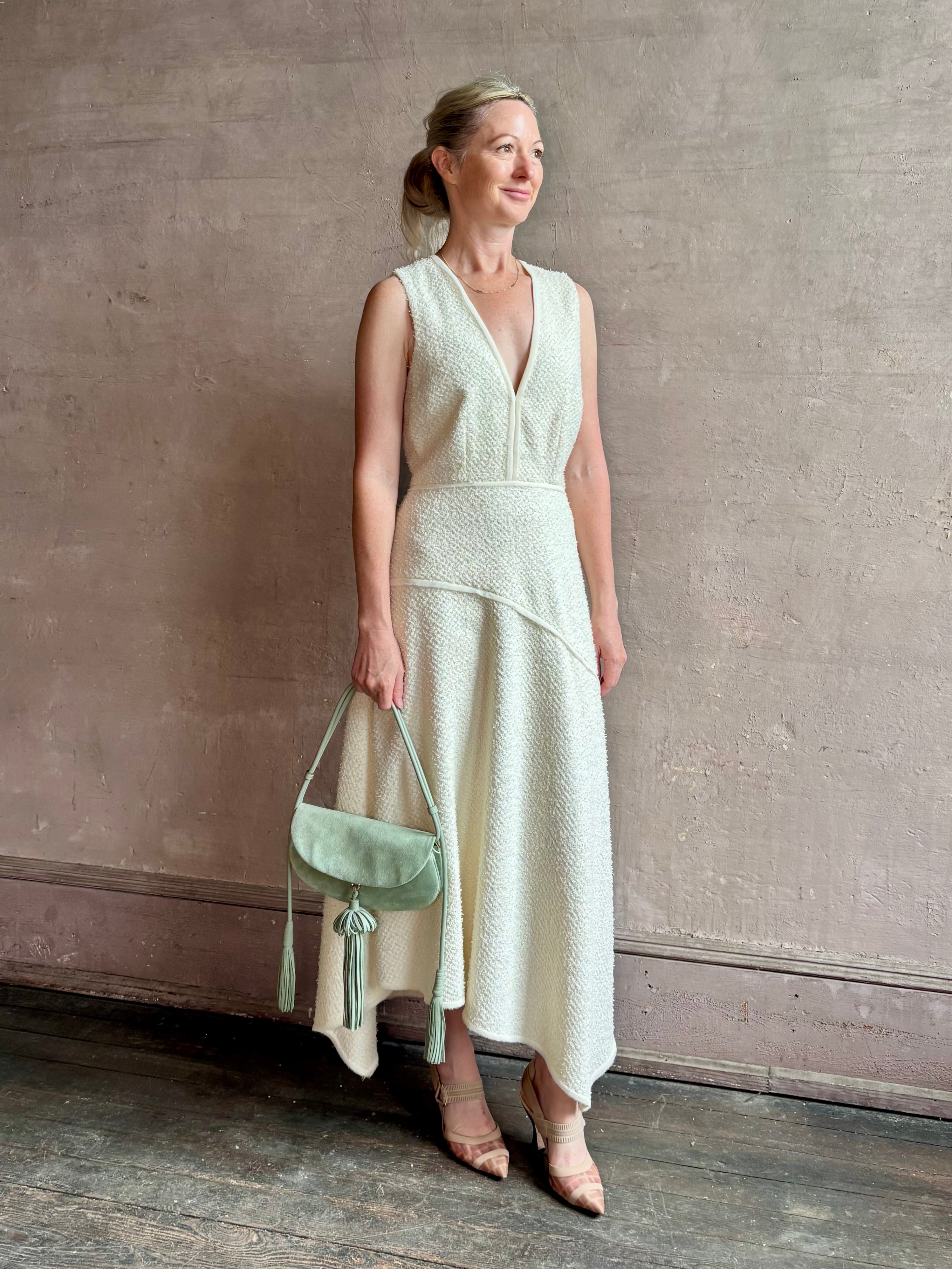 Woman wearing luxury Ulla Johnson Florence Dress concealed zip closure sleeveless fit and flare design