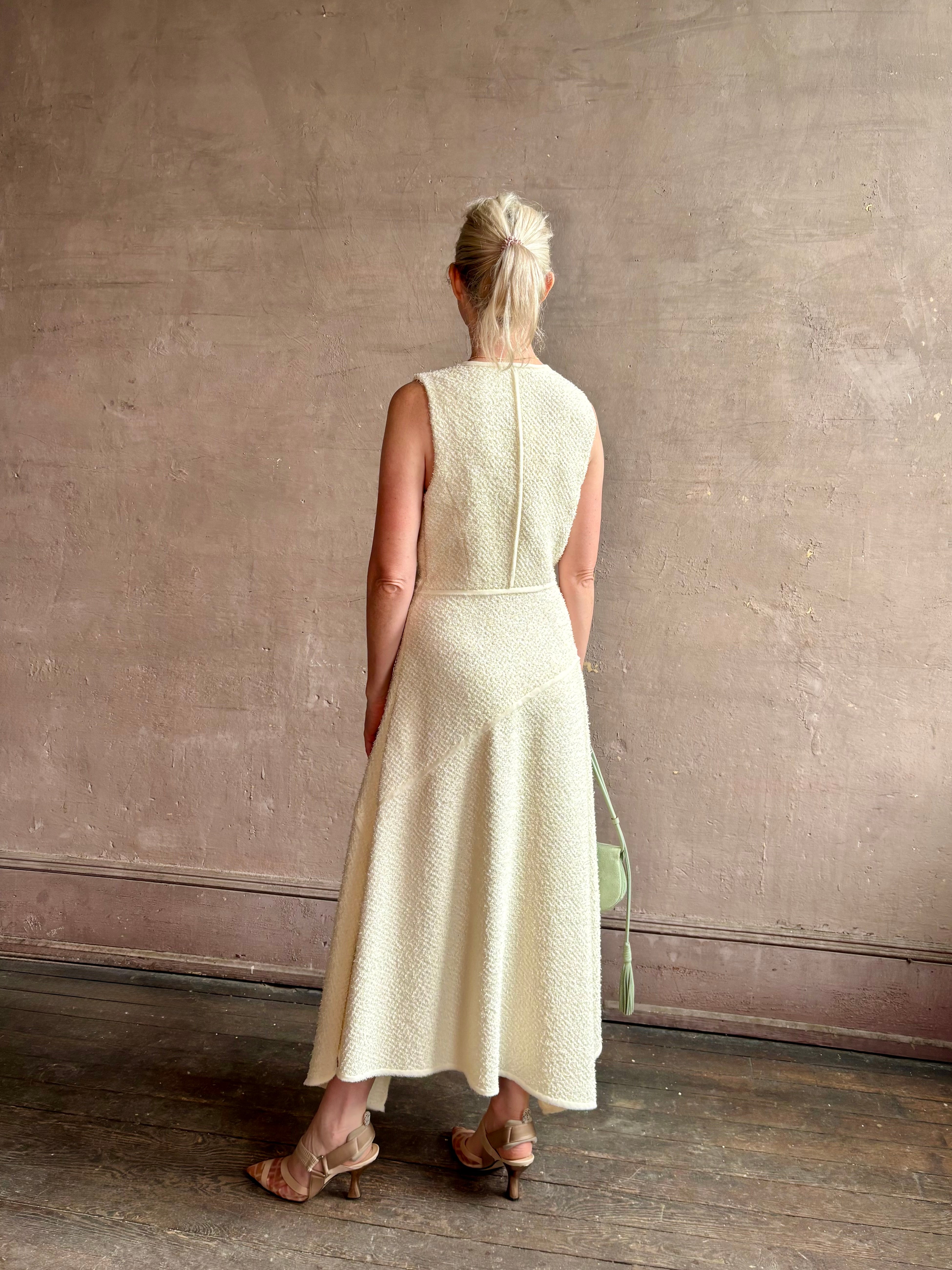 Woman wearing luxury Ulla Johnson Florence Dress concealed zip closure sleeveless fit and flare design