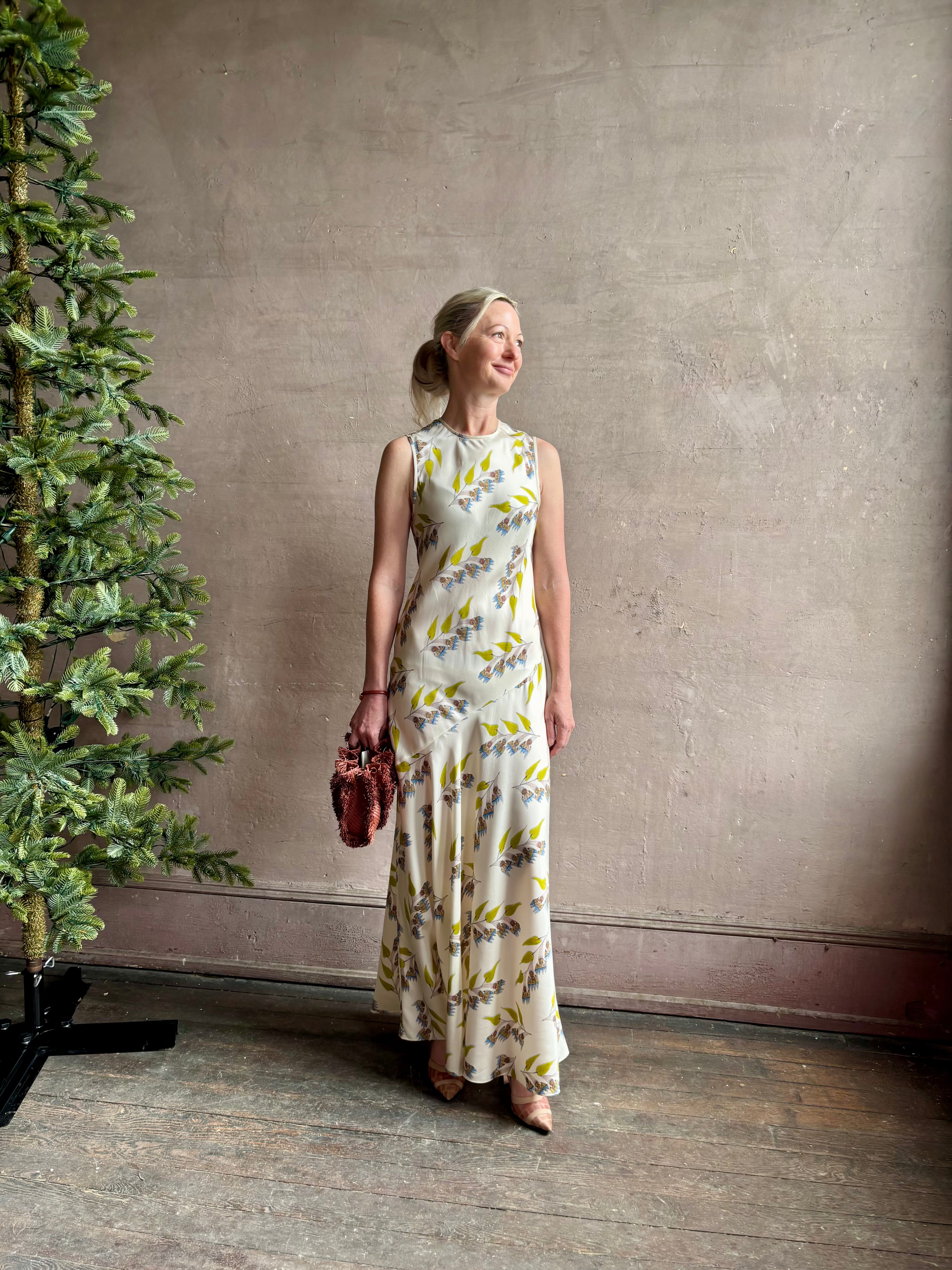 Mature woman wearing Ulla Johnson Gaea designer silk dress Infinite Flower print Czech artist Anna Zemankova collaboration