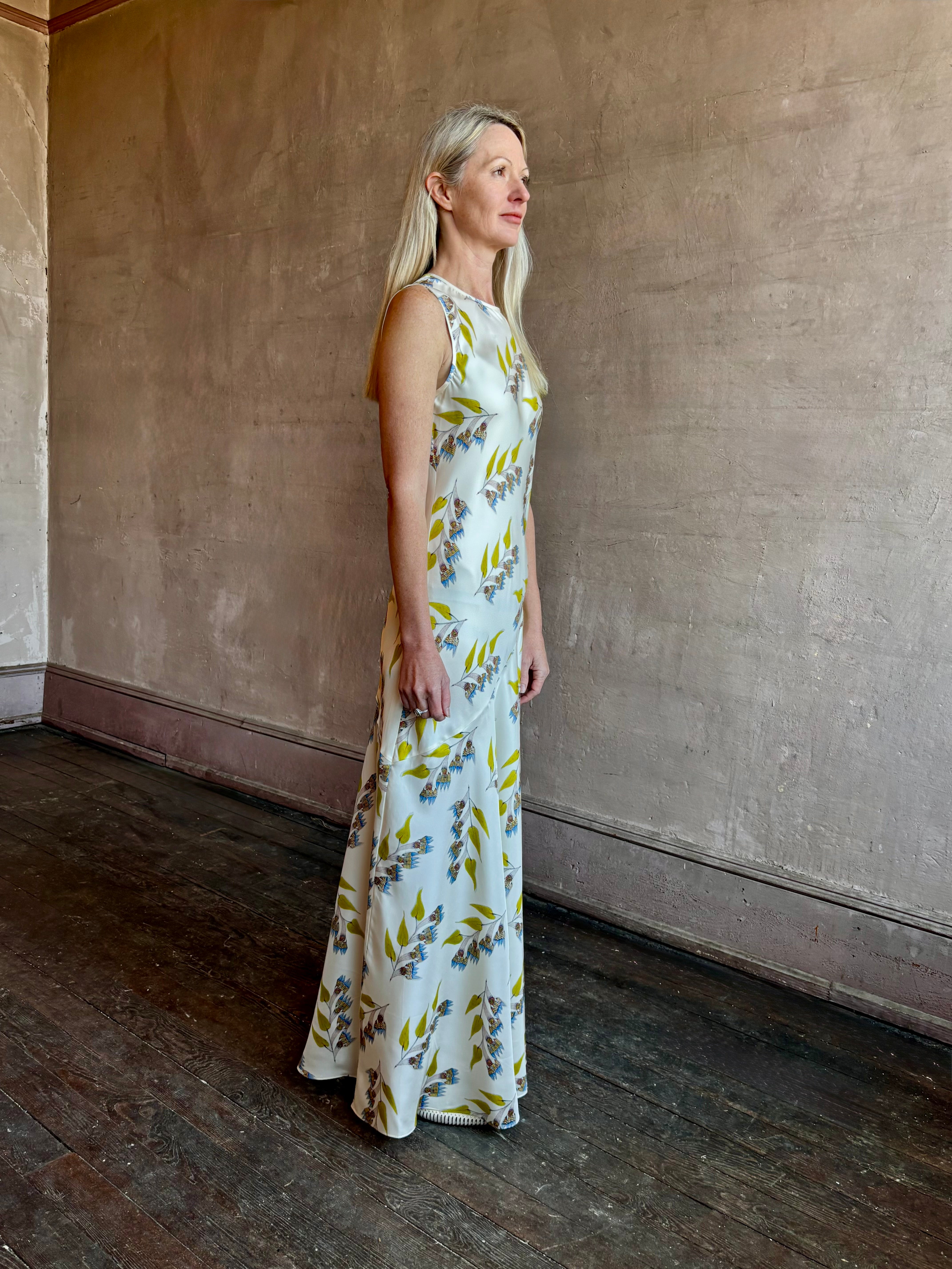 Image of mature woman wearing timeless limited edition ULLA JOHNSON Gaea maxi silk sheath Dress with floral prints from artist Anna Zemankova