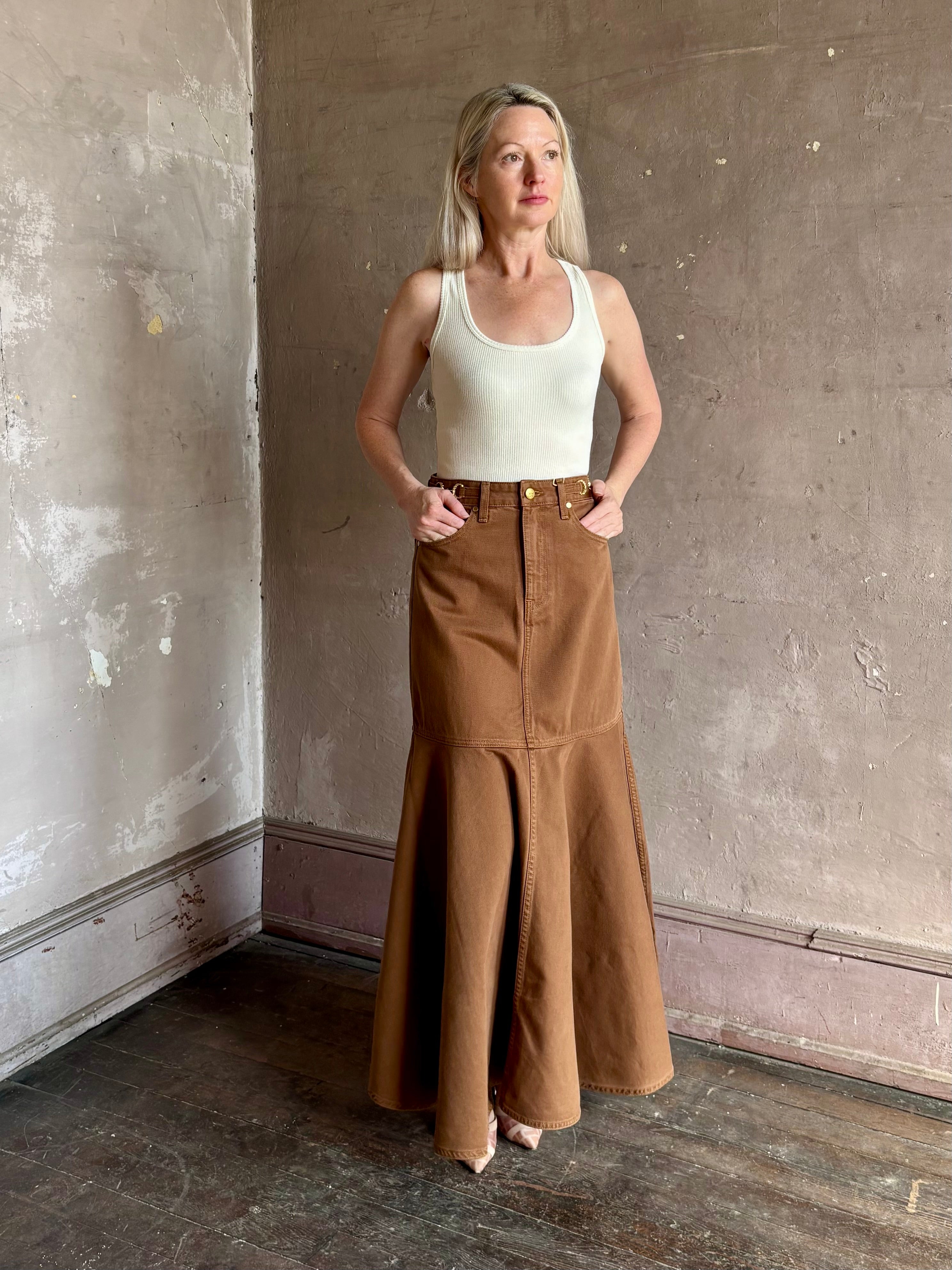 Mature woman wearing elevated designer Ulla Johnson Madelyn cotton denim skirt made in USA 