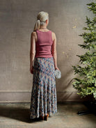 Mature woman wearing Ulla Johnson Marceline maxi knit cotton Skirt women's designer knit skirt Oasis colorway 