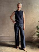 Mature woman wearing designer Margot sleeveless Knit Top from Ulla Johnson rendered in a rich midnight blue and knitted from 100% cotton with refined design details and a crew neckline