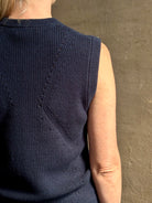 Mature woman wearing designer Margot sleeveless Knit Top from Ulla Johnson rendered in a rich midnight blue and knitted from 100% cotton with refined design details and a crew neckline for everyday sophistication