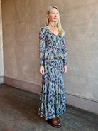 Woman wearing ULLA JOHNSON Marceline cotton knit Skirt with cascading slim rectangles in navy, aqua, pink and cream