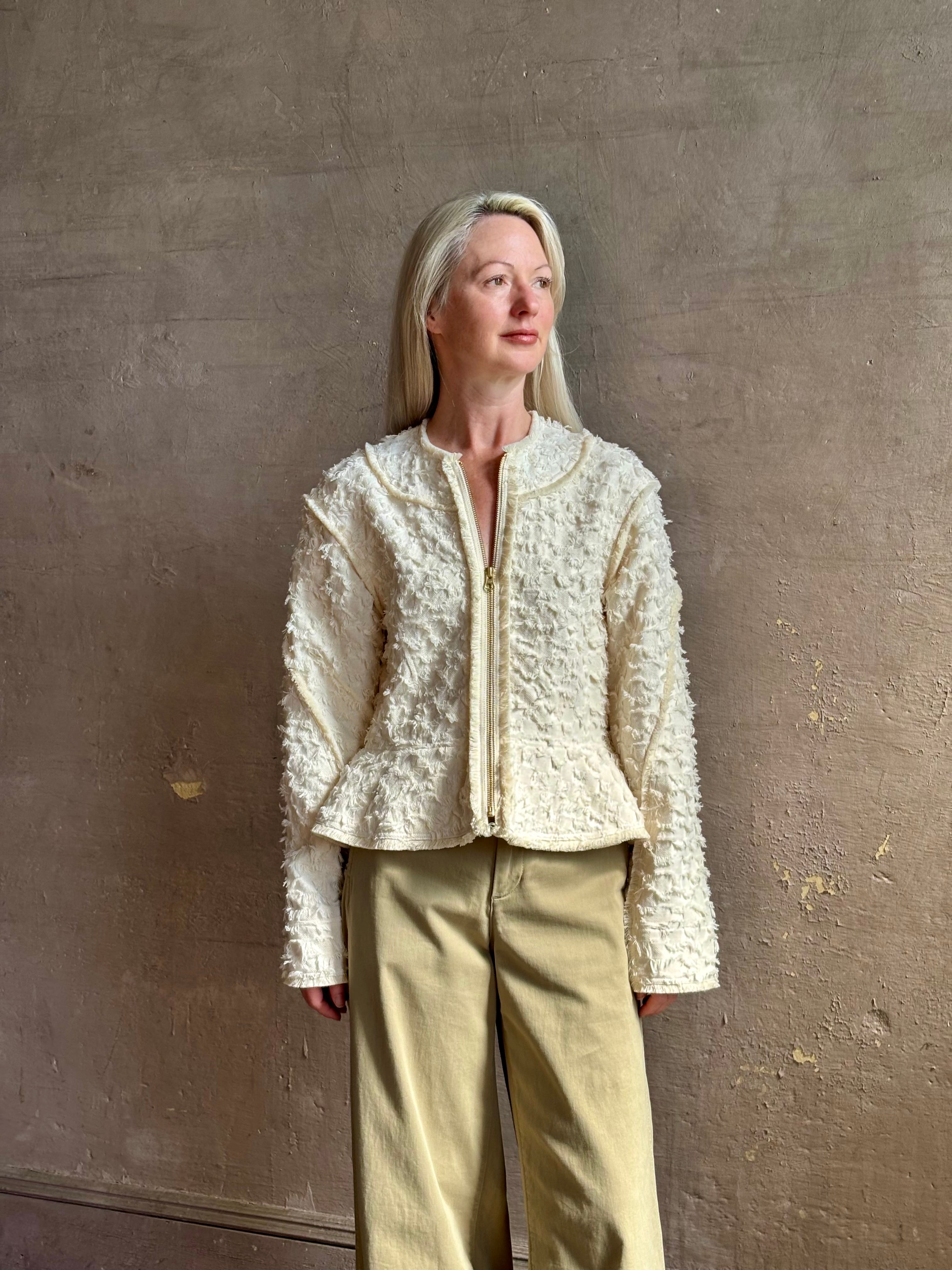 woman wearing designer Ulla Johnson Rosalind tailored peplum premium cotton Jacket checkered fringe texture
