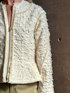 woman wearing designer Ulla Johnson Rosalind tailored peplum cotton zip up Jacket checkered fringe texture
