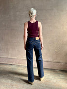 Woman wearing ULLA JOHNSON  Agatha Straight Leg Pintuck Rigid Denim jean in Tigris wash with horsebit detail