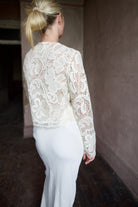 Mature woman wearing Ulla Johnson Caris Jacket delicate white lace button down features embroidered florals