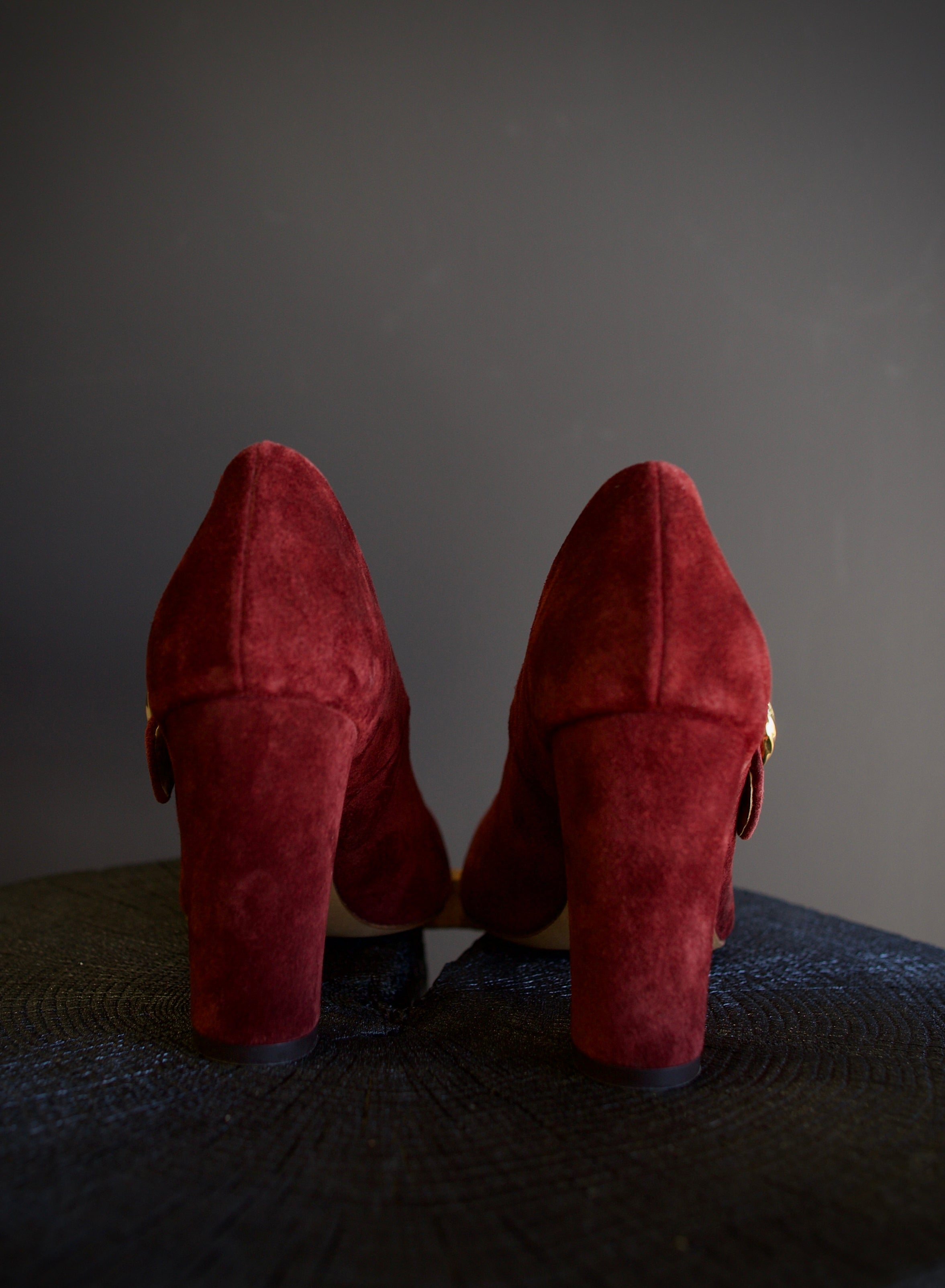 Image featuring the Kiki burgundy suede heels by Ulla Johnson with a pointed leather toe, gold finish buckle closure and a 3.5" tall block heel.