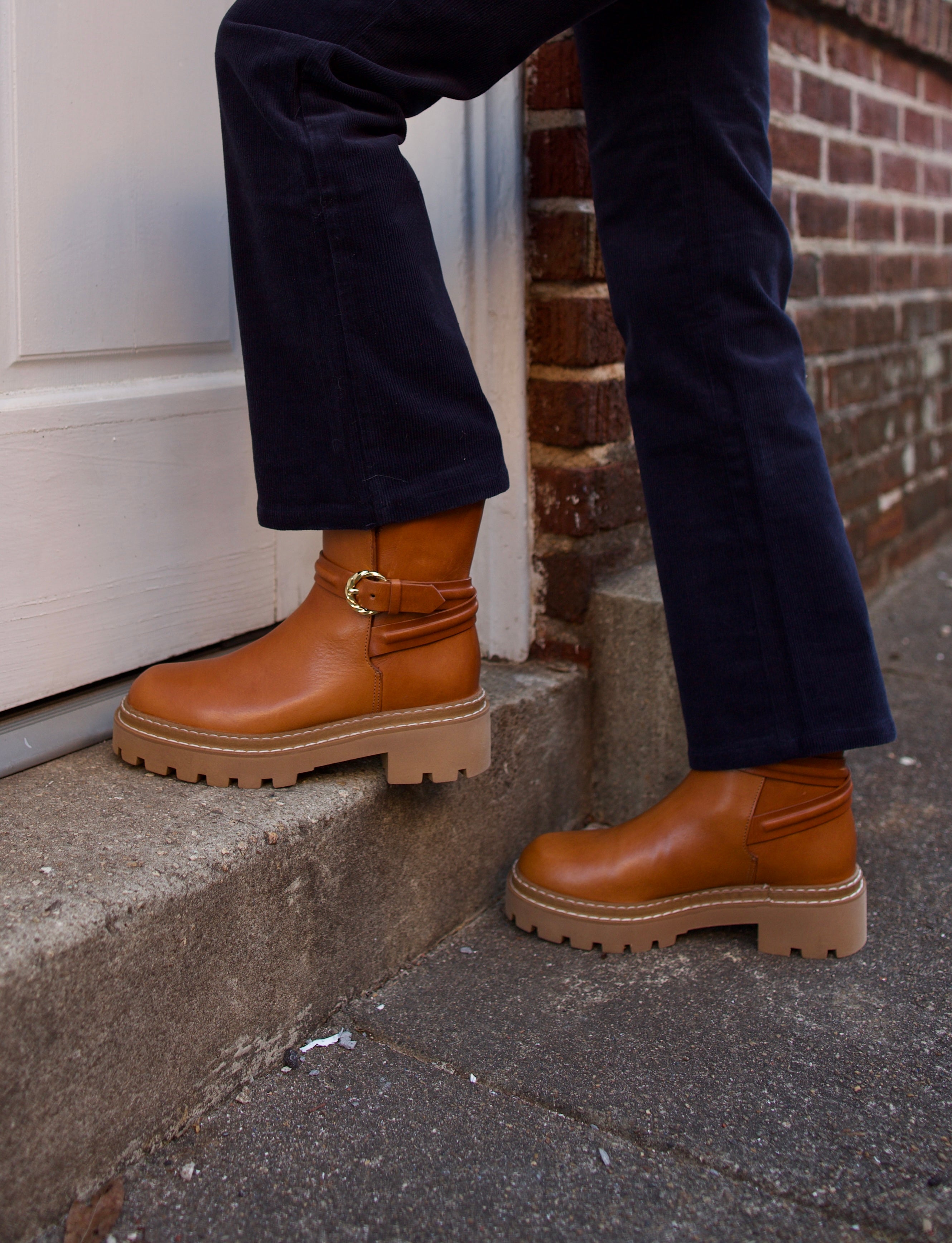 Image of woman wearing the Ulla Johnson Lennon Lugsole Boots