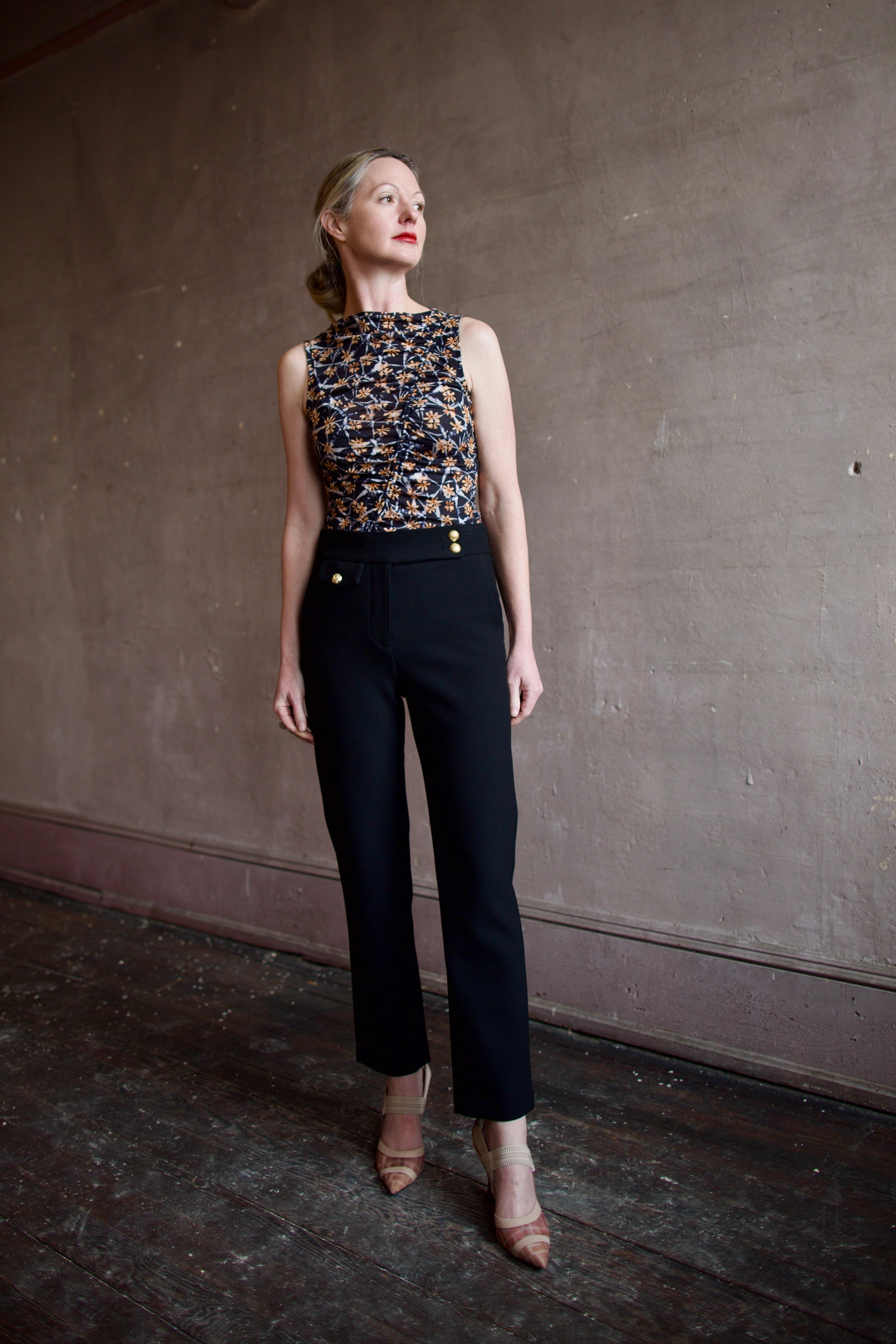 Image of a mature woman wearing the Ulla Johnson medea top and Veronica Beard renzo pants that's easily transitions business to casual