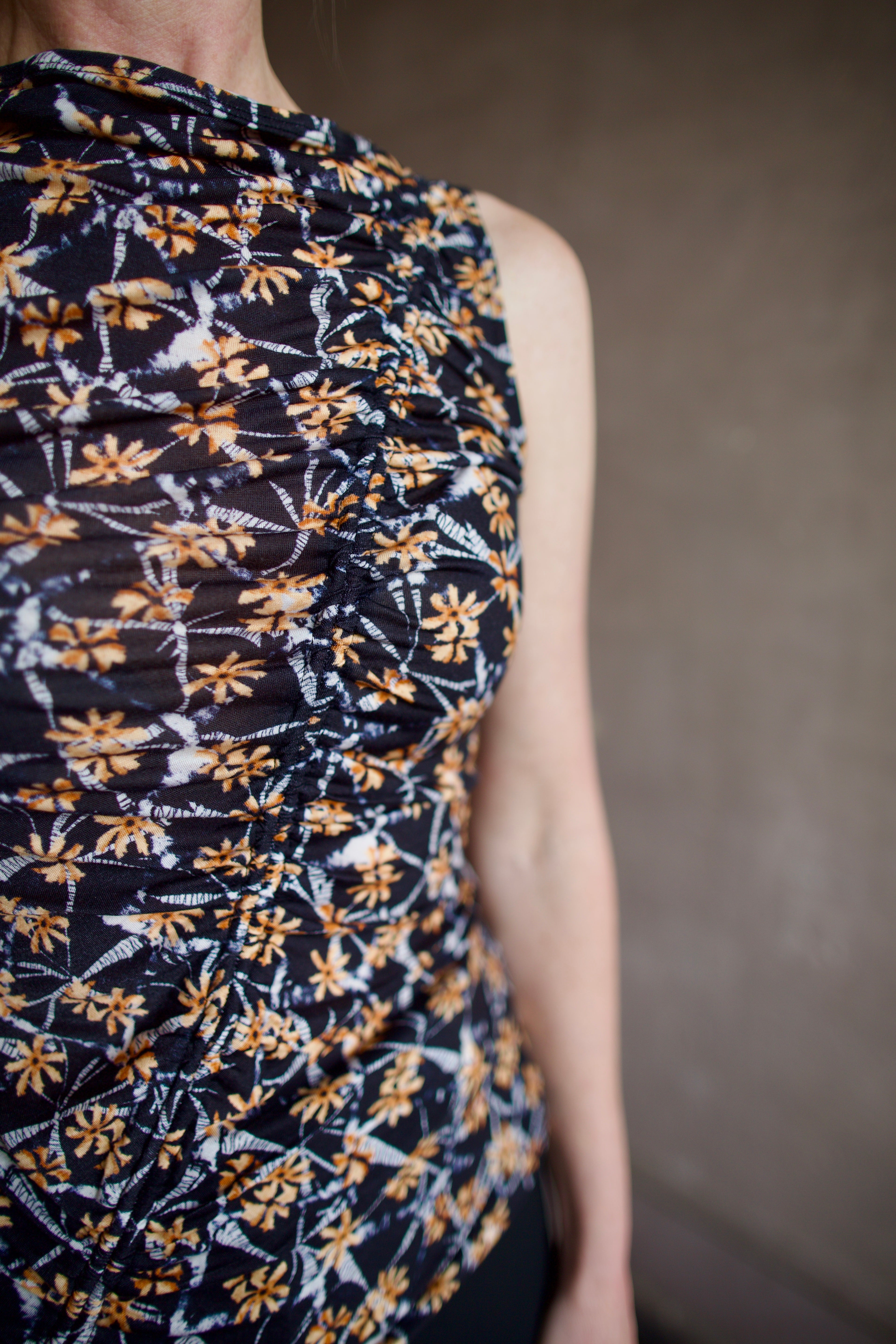 Up close detail of ruching detail running diagonally across front of ulla johnson medea top in stretchy lightweight lyocell fabric