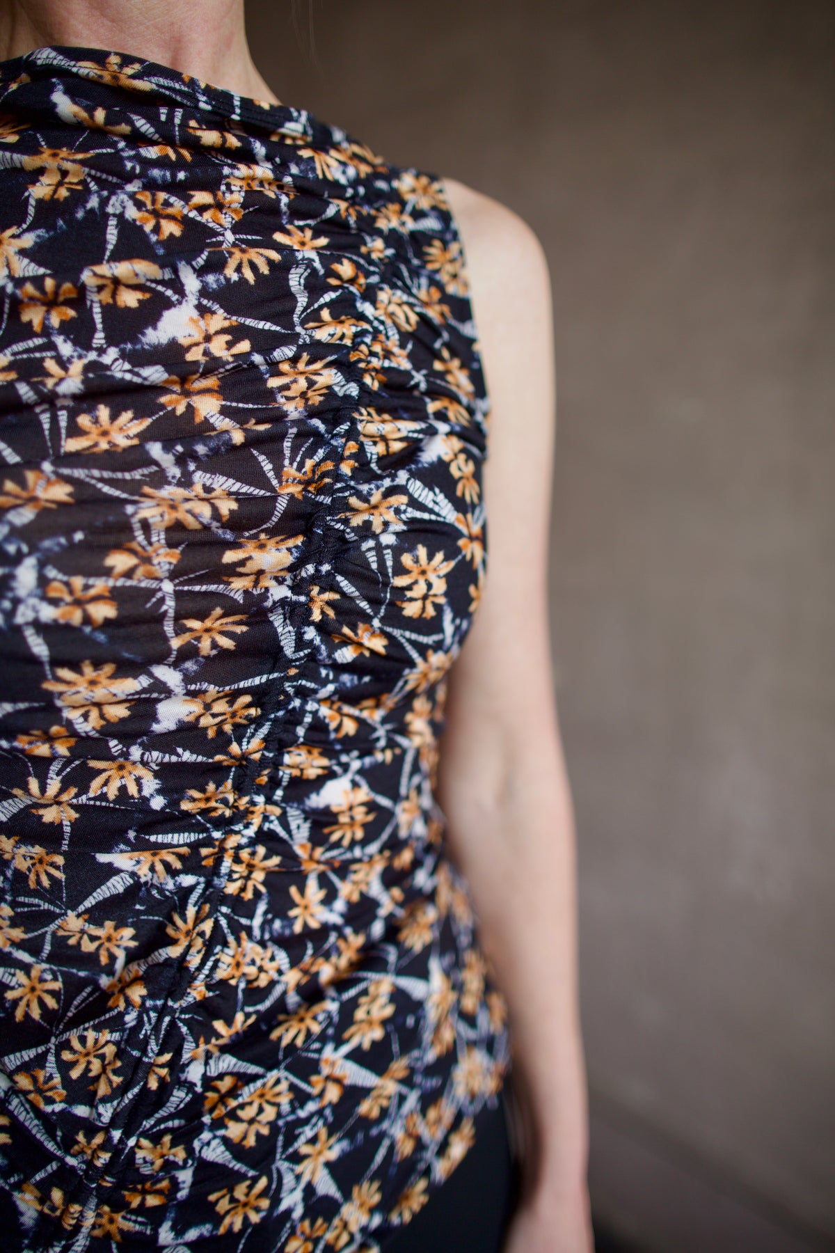 Up close detail of ruching detail running diagonally across front of ulla johnson medea top in stretchy lightweight lyocell fabric