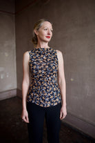 Mature woman wearing ulla johnson medea top in Aura sustainable premium lyocell  flattering ruching for elevated casual wear