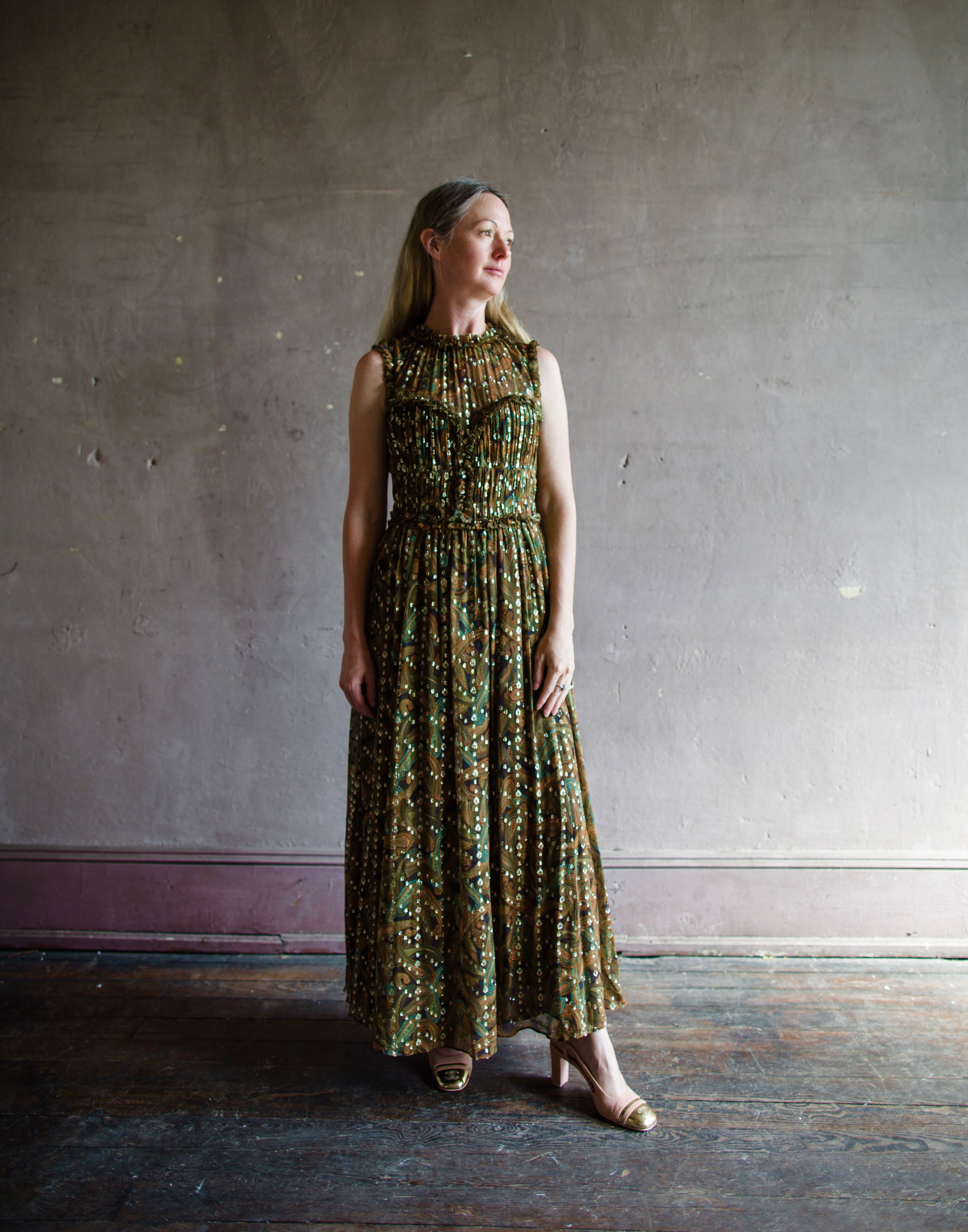 Image featuring a woman wearing the Kasia silk dress by Ulla Johnson with a crew neckline sheer to semi fitted bustier top and maxi A-line skirt.