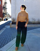 woman wearing Ulla Johnson gia leather belt with gold finish twist buckle in Sierra brown
