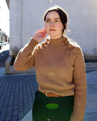 woman wearing Ulla Johnson gia leather belt with gold finish twist buckle in Sierra brown
