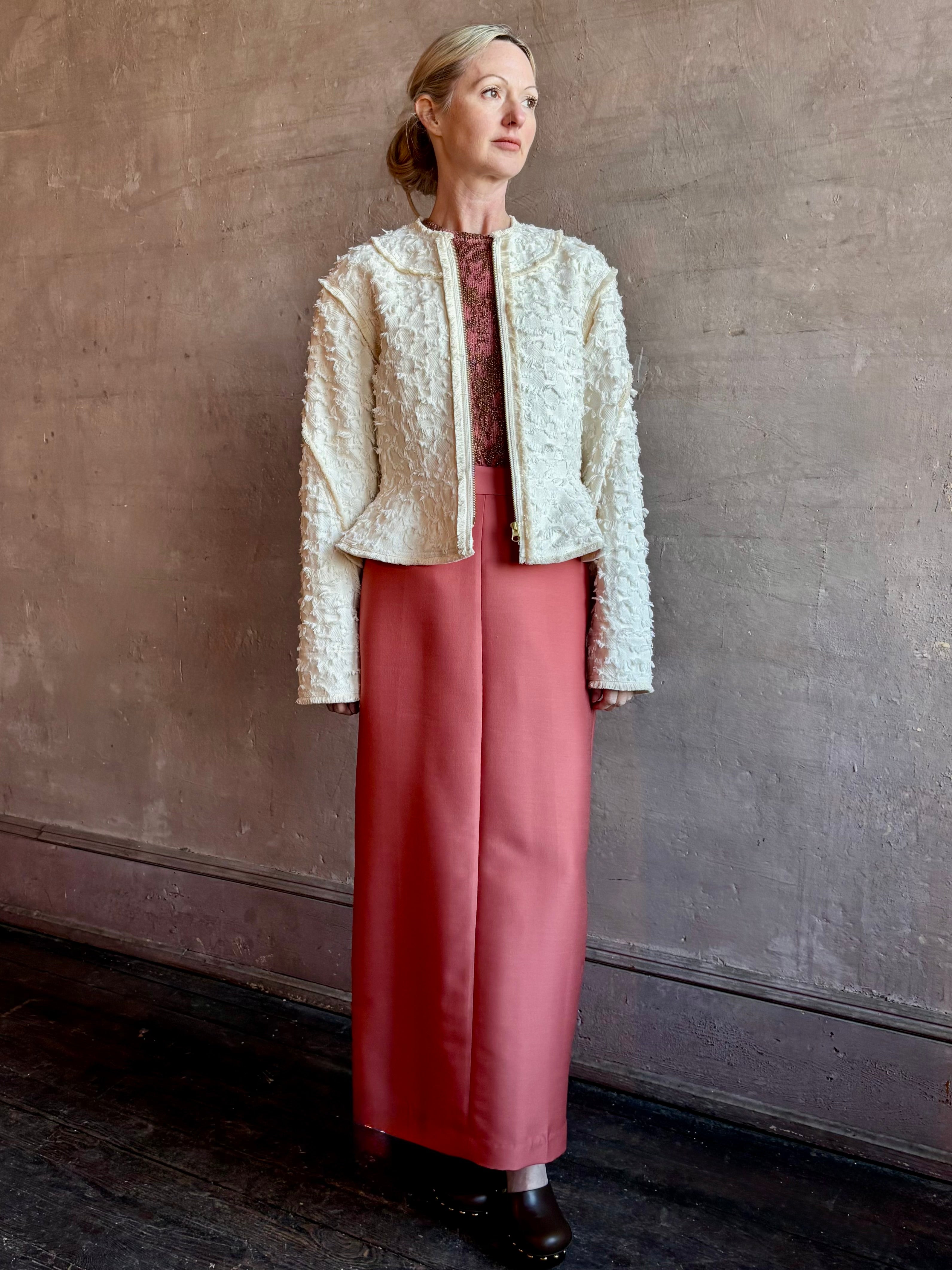 Image of woman wearing designer Ulla Johnson Rosalind tailored peplum Jacket in Premium Cotton with checkered fringe texture