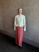 Image of woman wearing designer Ulla Johnson Rosalind tailored peplum Jacket in Premium Cotton with checkered fringe texture