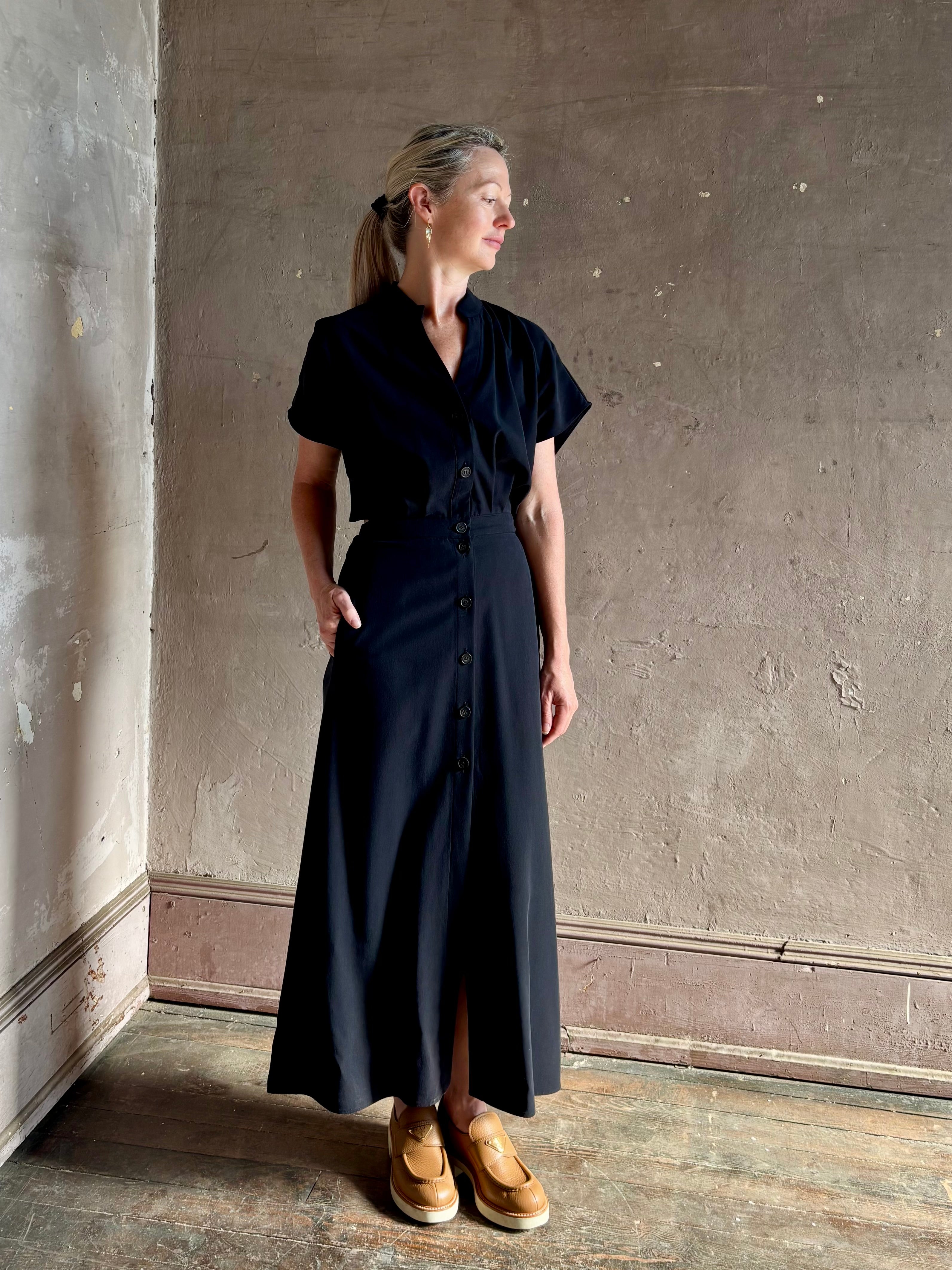 Woman wearing Vanessa Bruno classic button-front Cheryle maxi dress with open back detail short sleeve v-neck
