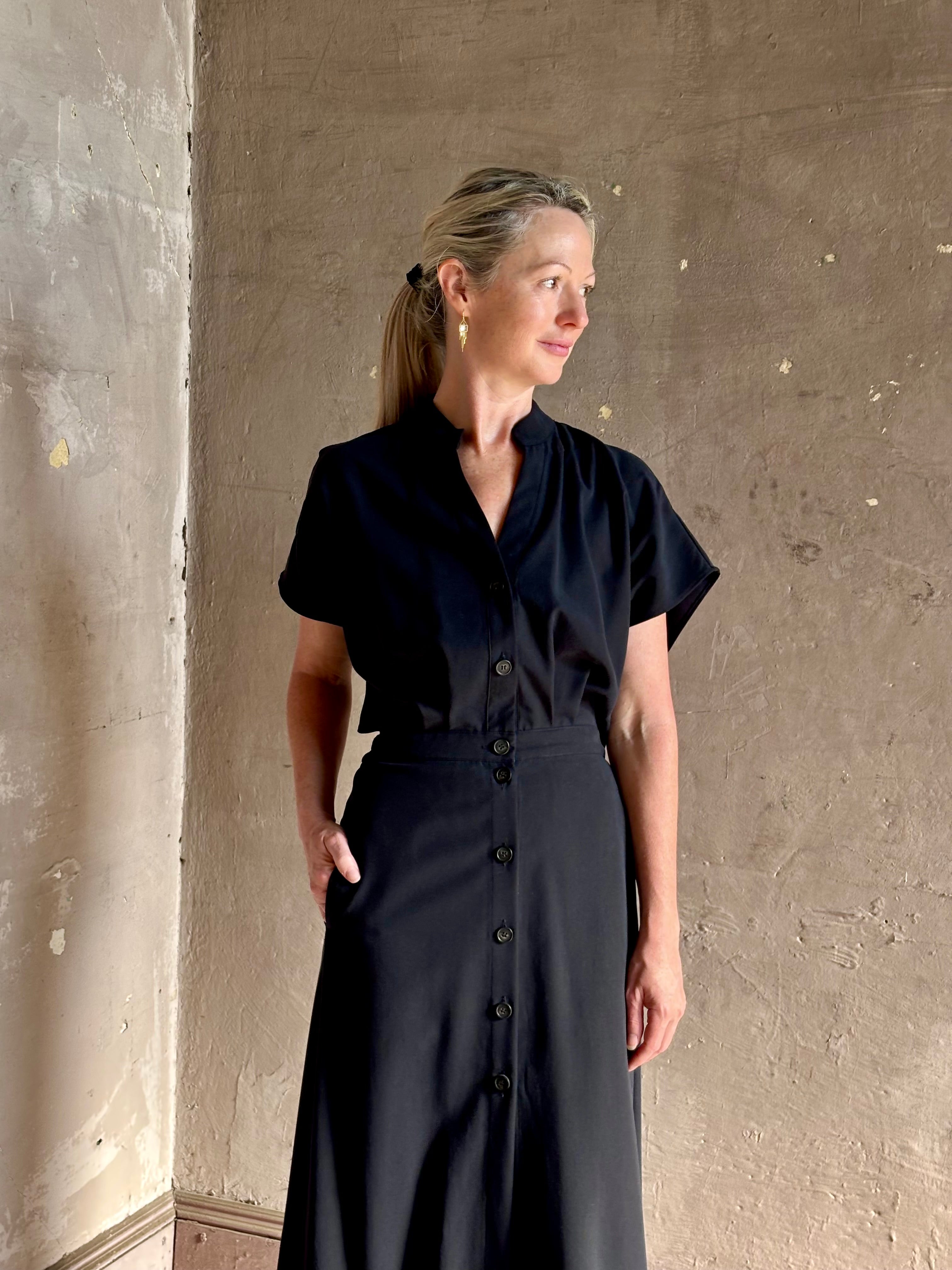 Woman wearing Vanessa Bruno classic button-front Cheryle maxi dress with open back detail short sleeve v-neck