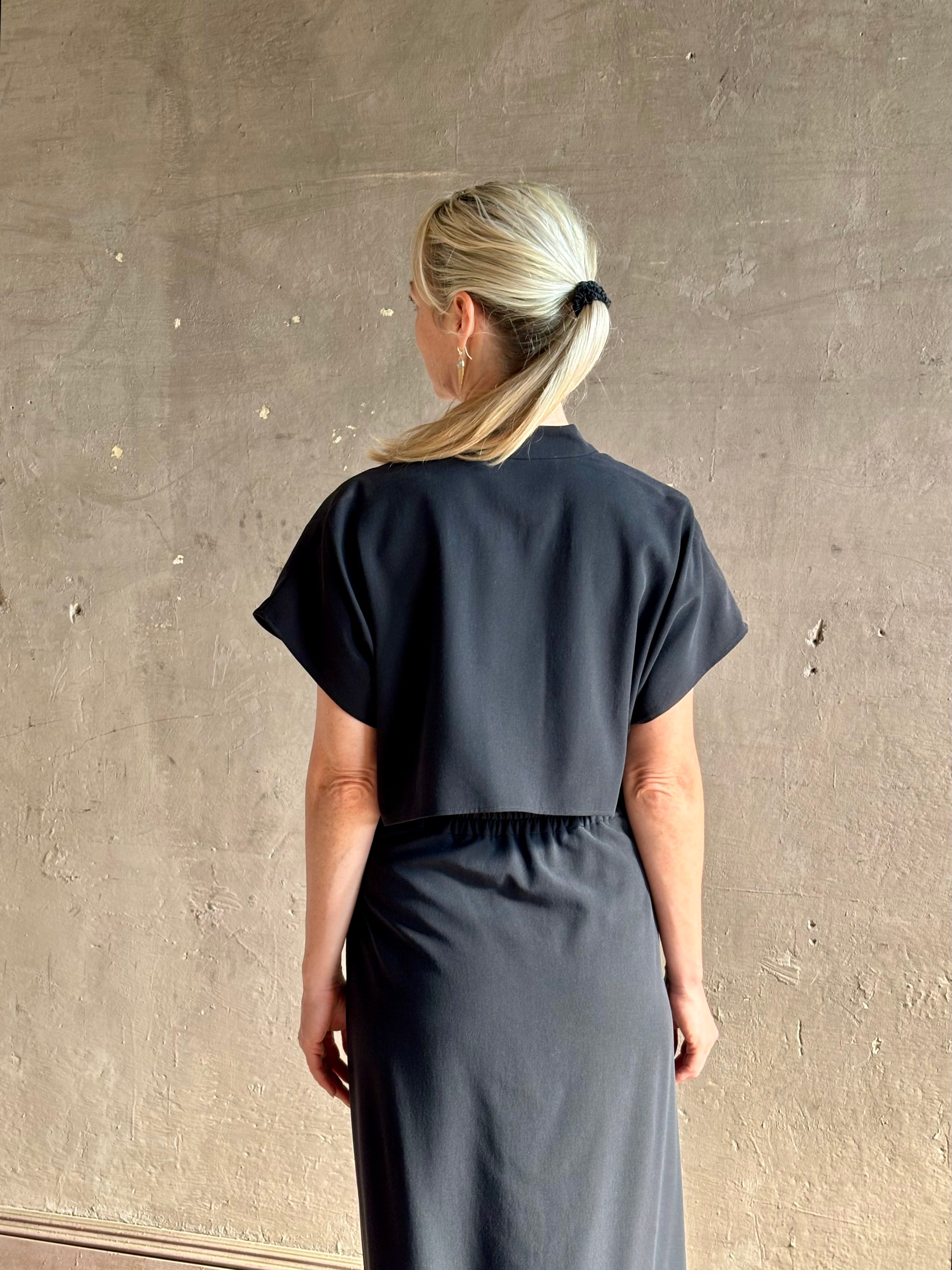 Woman wearing Vanessa Bruno classic button-front Cheryle maxi dress with open back detail short sleeve v-neck