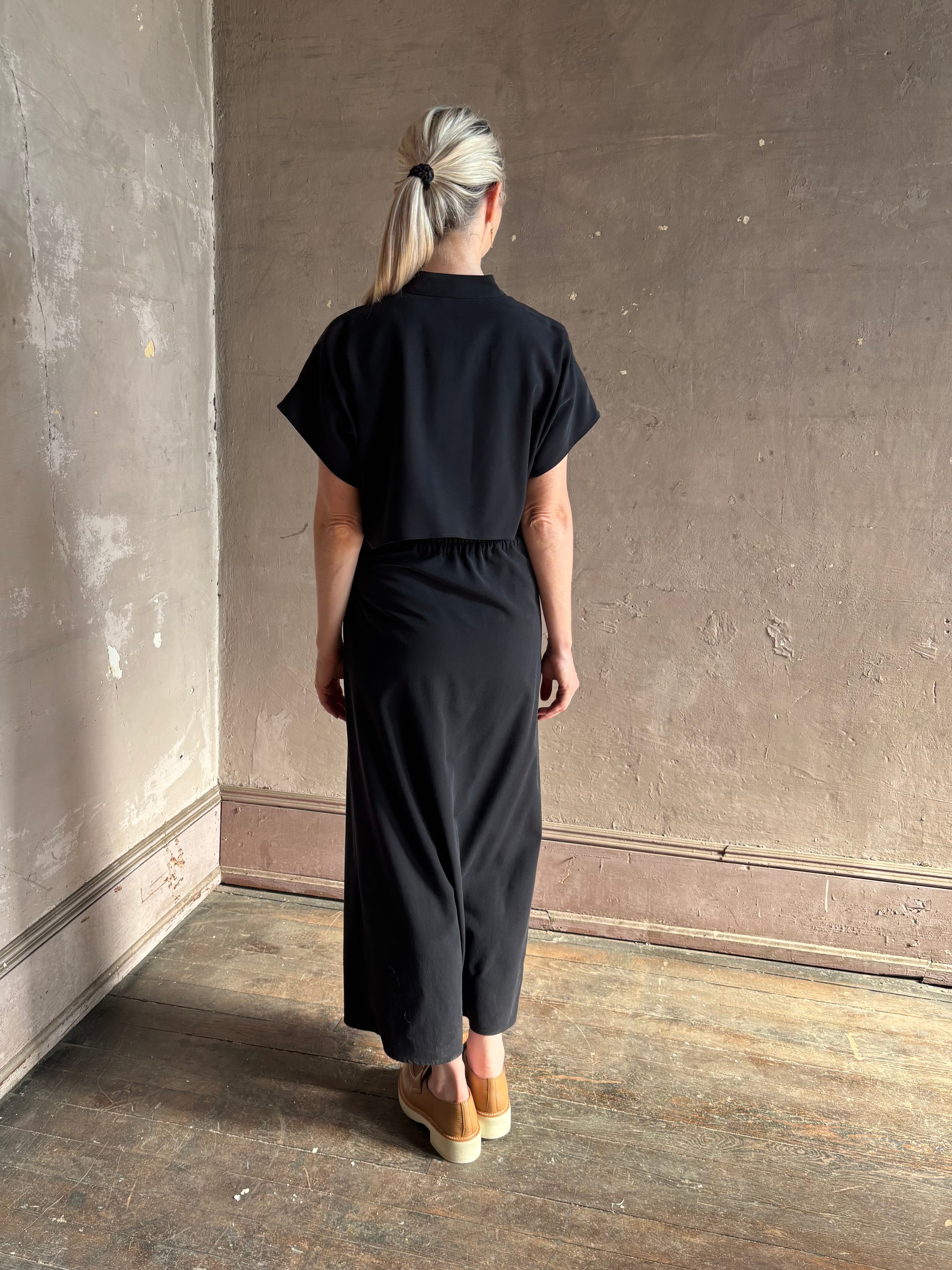 Woman wearing Vanessa Bruno classic button-front Cheryle maxi dress with open back detail short sleeve v-neck