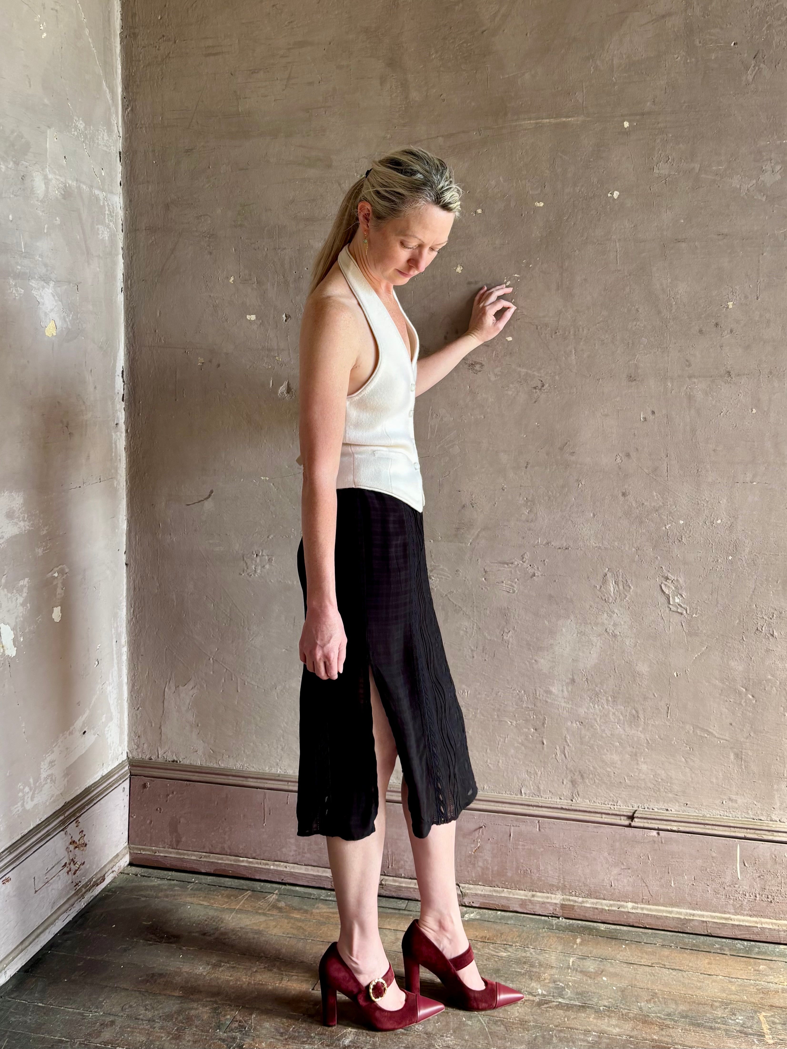woman wearing Vanessa Bruno midi skirt semi-sheer jacquard black-on-black plaid delicate eyelet and pintucking